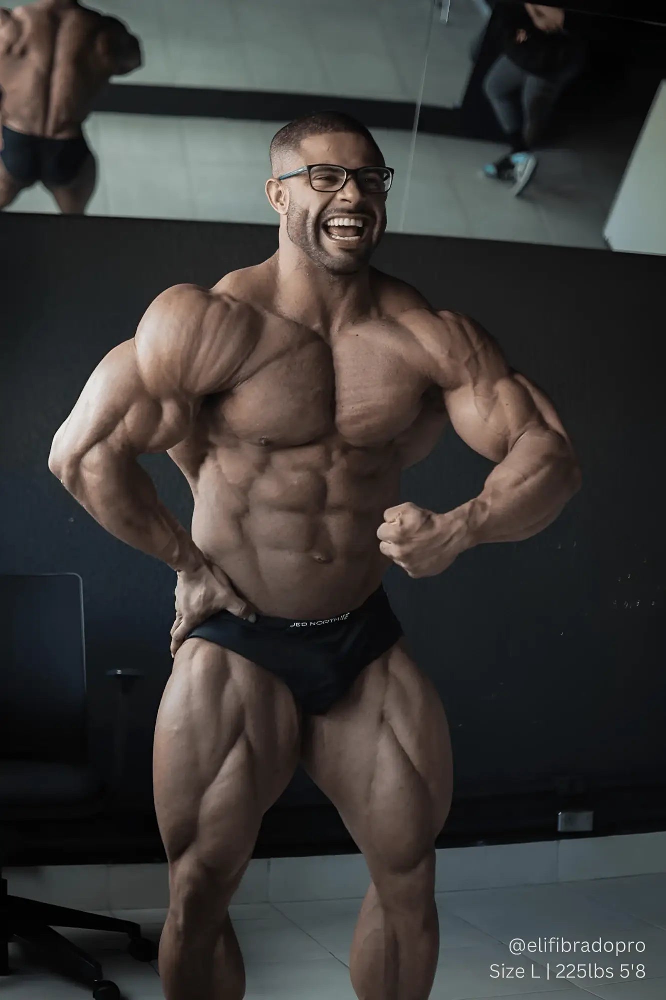 A muscular man wearing black jed north men’s seamless muscle-fit boxers with a visible brand logo front view