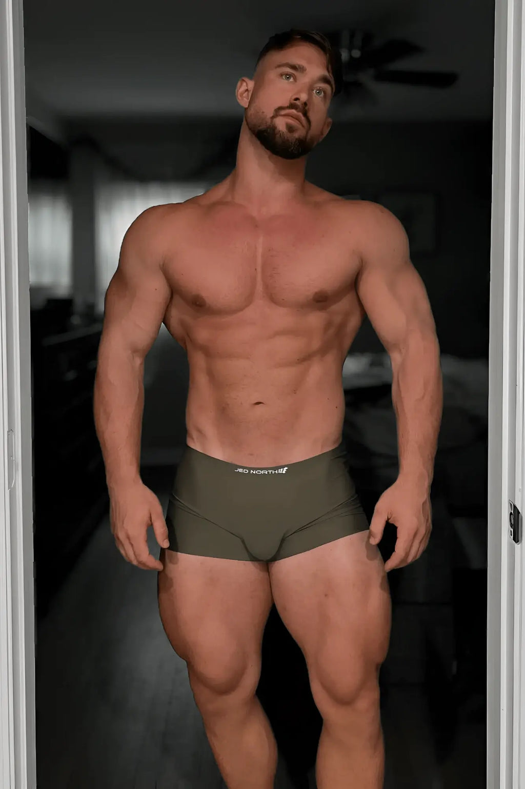 Olive green seamless muscle-fit athletic briefs with a white logo on the waistband from jed north men’s 2-pack boxers