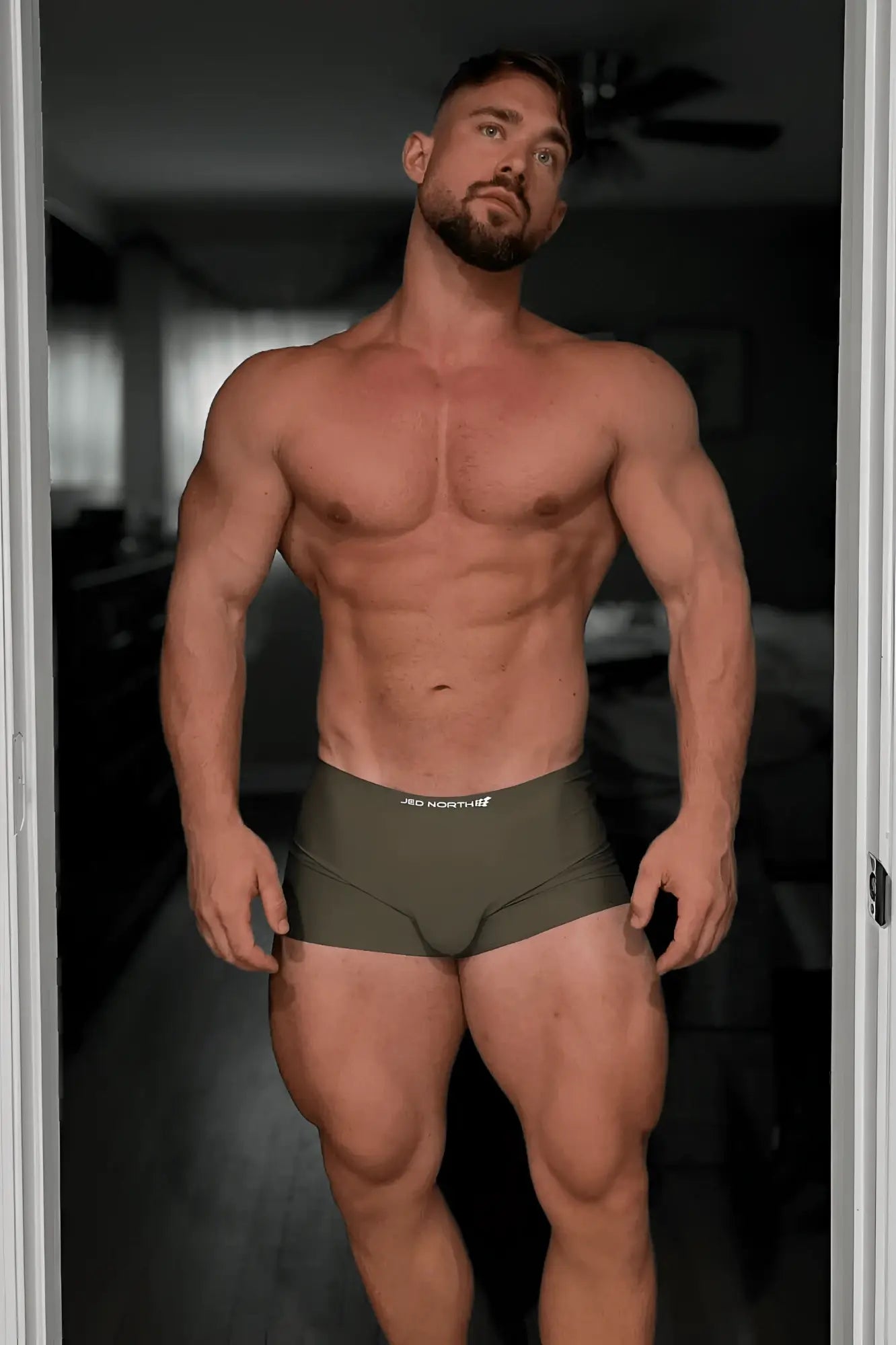 Olive green seamless muscle-fit athletic briefs with a white logo on the waistband from jed north men’s 2-pack boxers