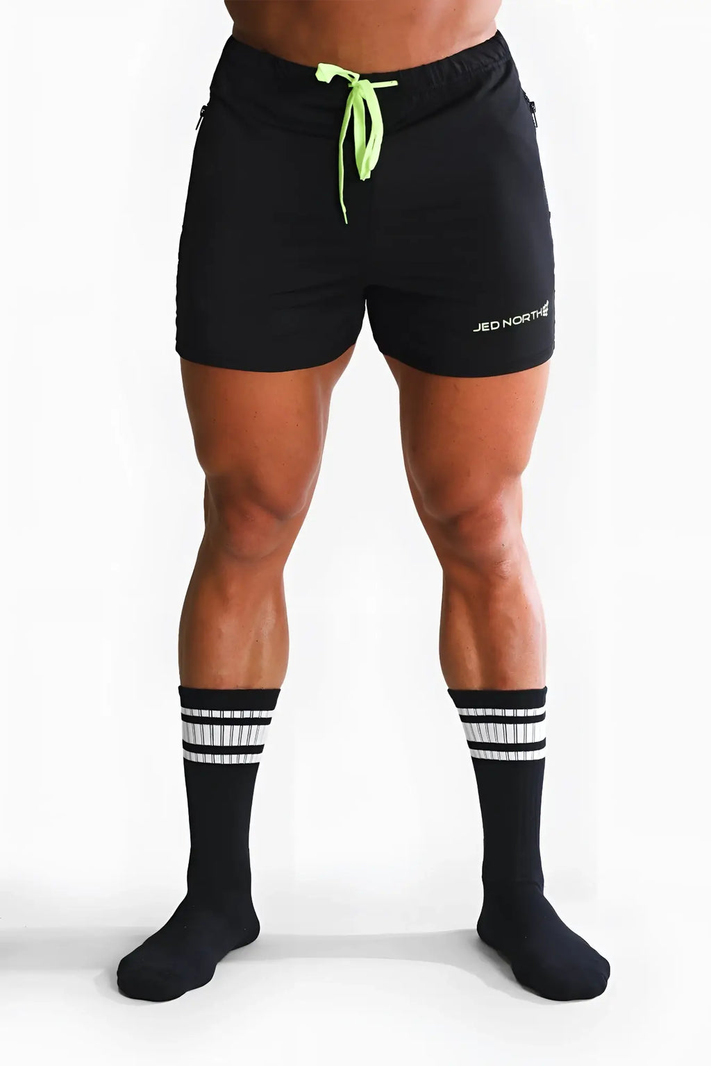 Men’s black athletic shorts with neon green drawstring and jed north branding on the left leg