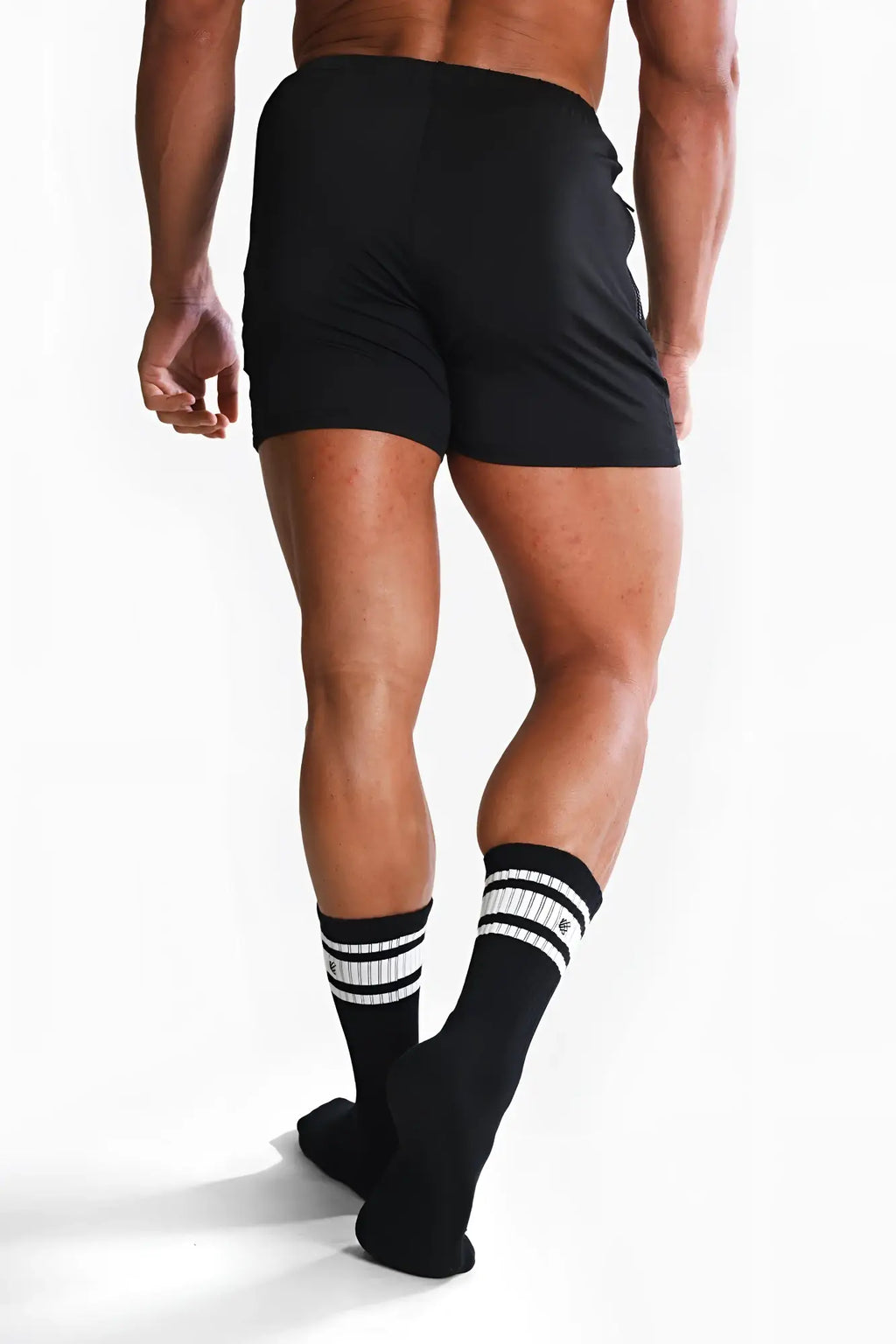 Men’s striped crew socks in black with breathable fabric and a comfortable fit for athletic and casual wear