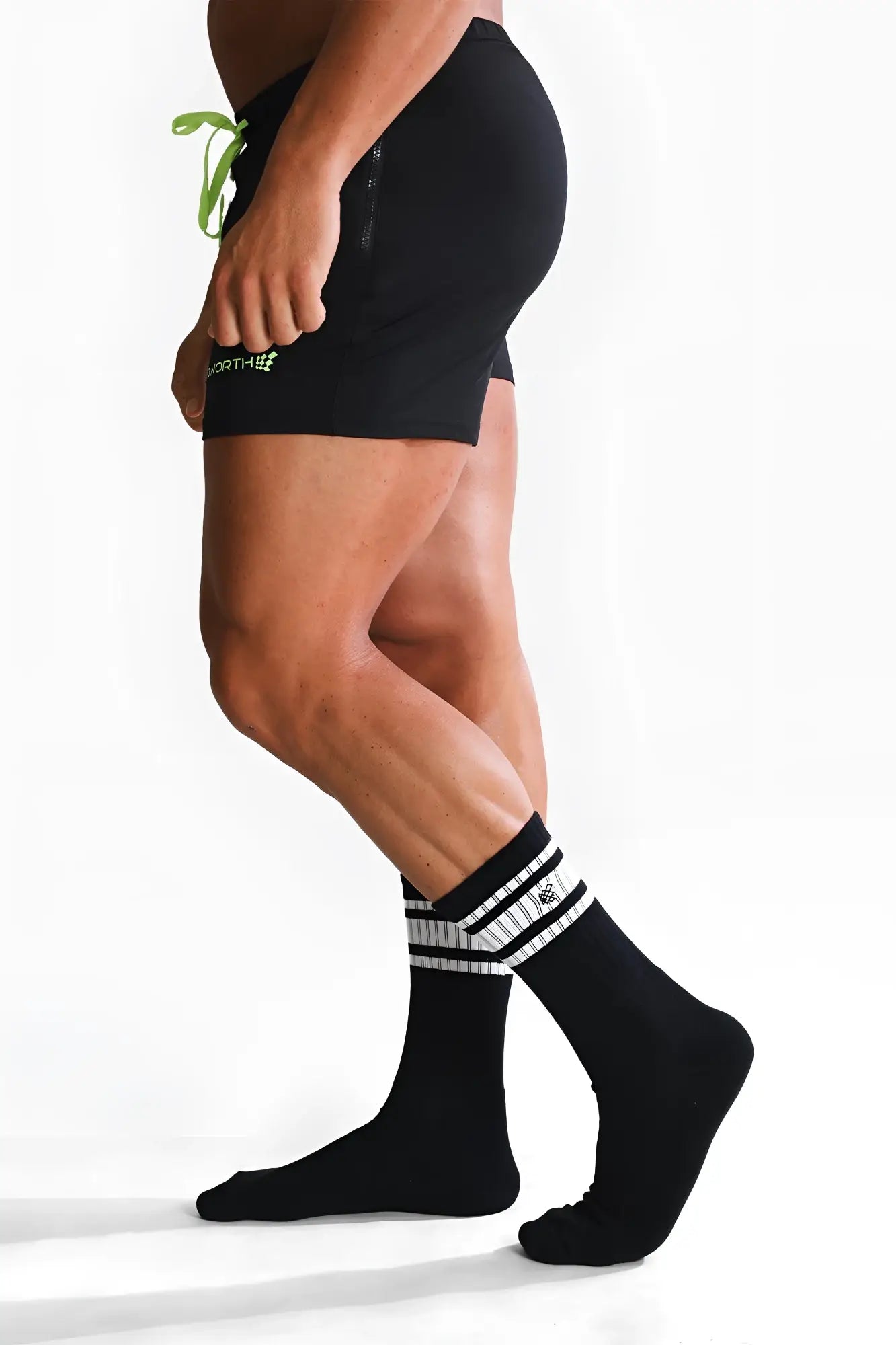 Men’s striped crew socks in black with white horizontal stripes and a small logo on the side for athletic wear