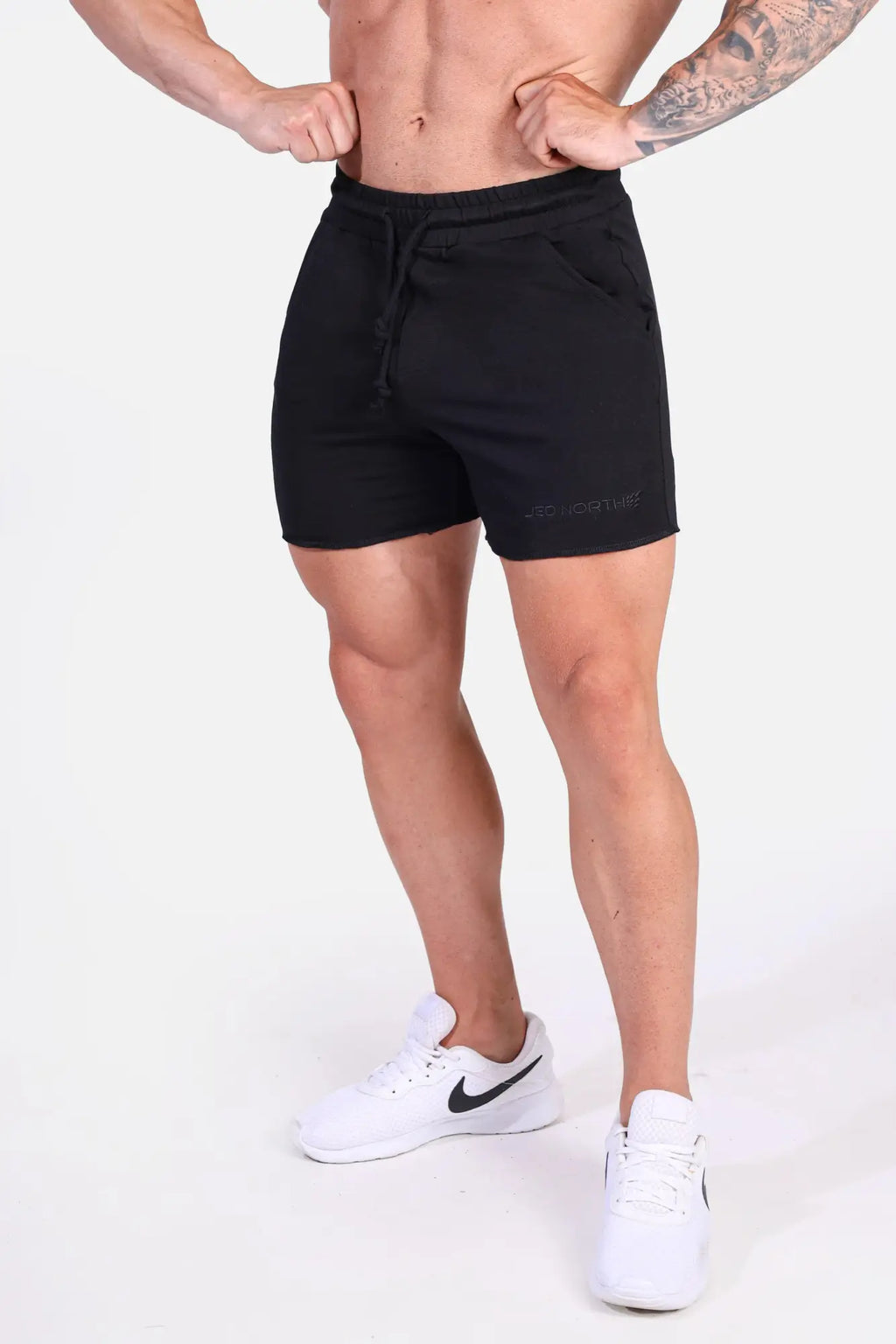 Black Jed North Motion 5 inch varsity sweat shorts with drawstring waistband side pockets and subtle lower leg branding