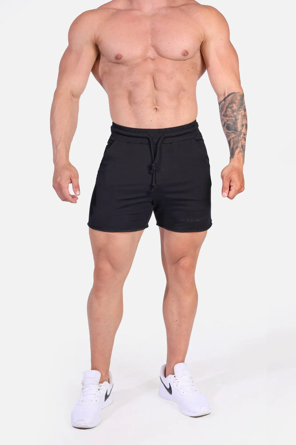 Jed North Motion 5 inch varsity sweat shorts in black with drawstring waistband and subtle branding on lower right leg