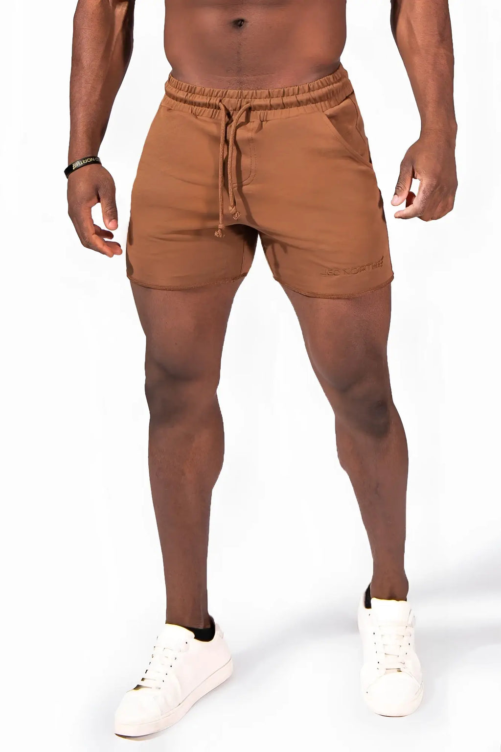 Motion 5 inch varsity sweat shorts in brown with tan drawstring, relaxed fit, and subtle side brand embroidery