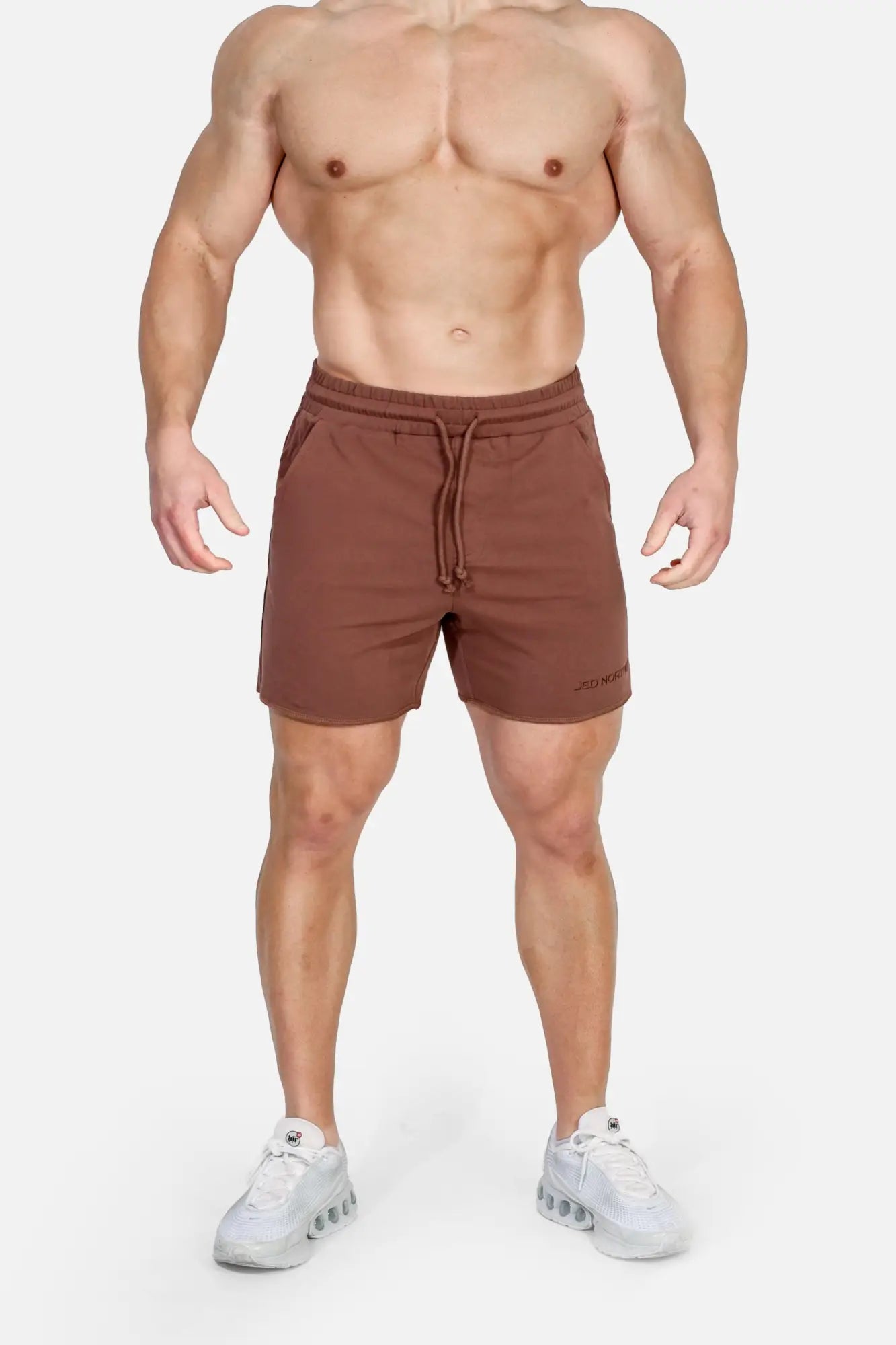 Jed North motion 5 inch varsity sweat shorts in dark brown with a drawstring waistband and subtle side stripes