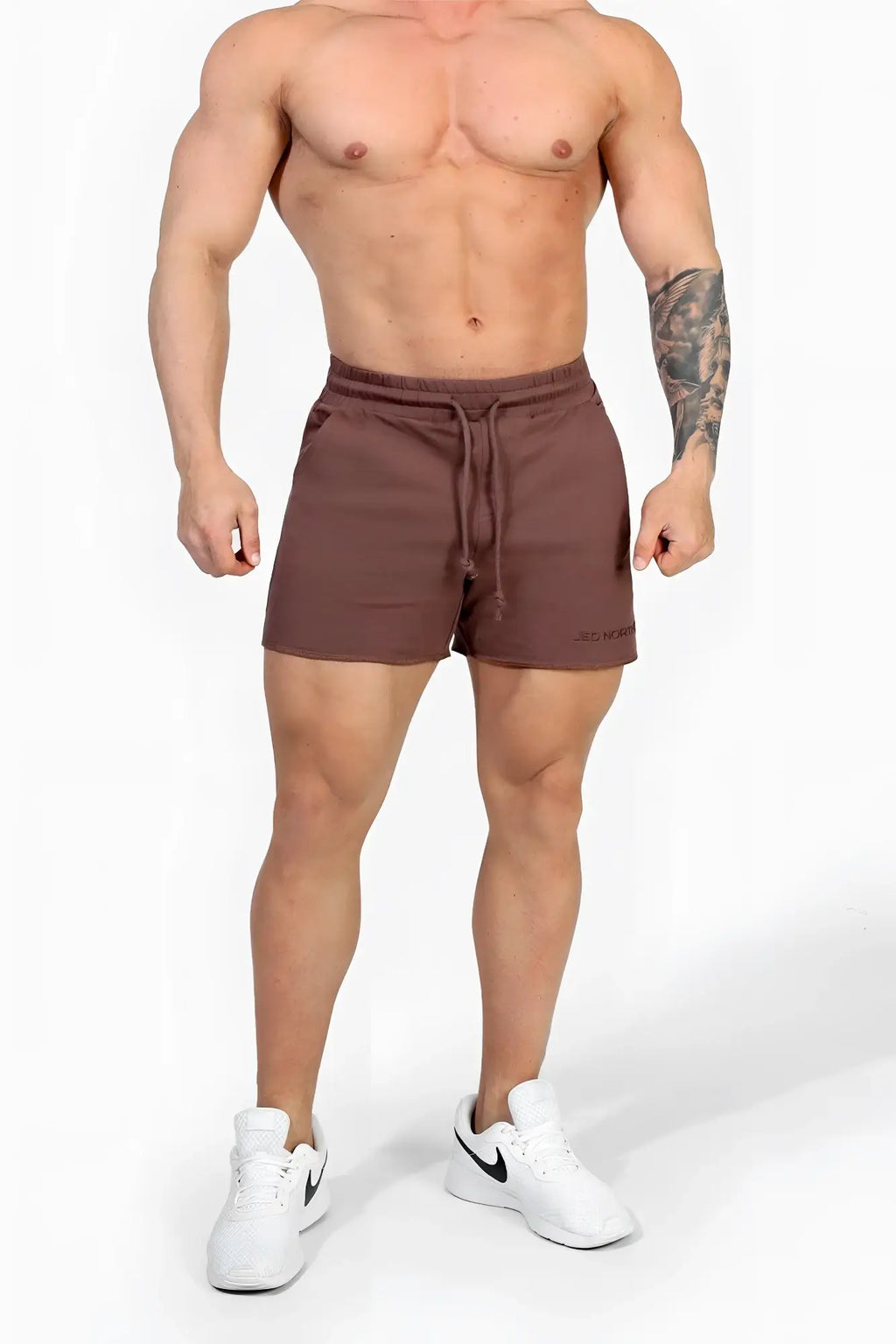 Jed North motion 5 inch varsity sweat shorts in dark brown with a subtle brand logo on the lower right leg