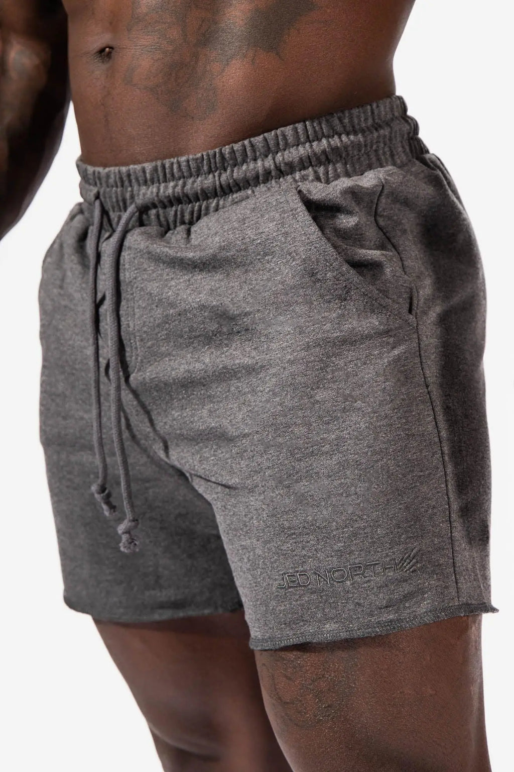 Motion 5 inch varsity sweat shorts in dark gray heathered fabric with drawstring waistband side pockets and red north logo