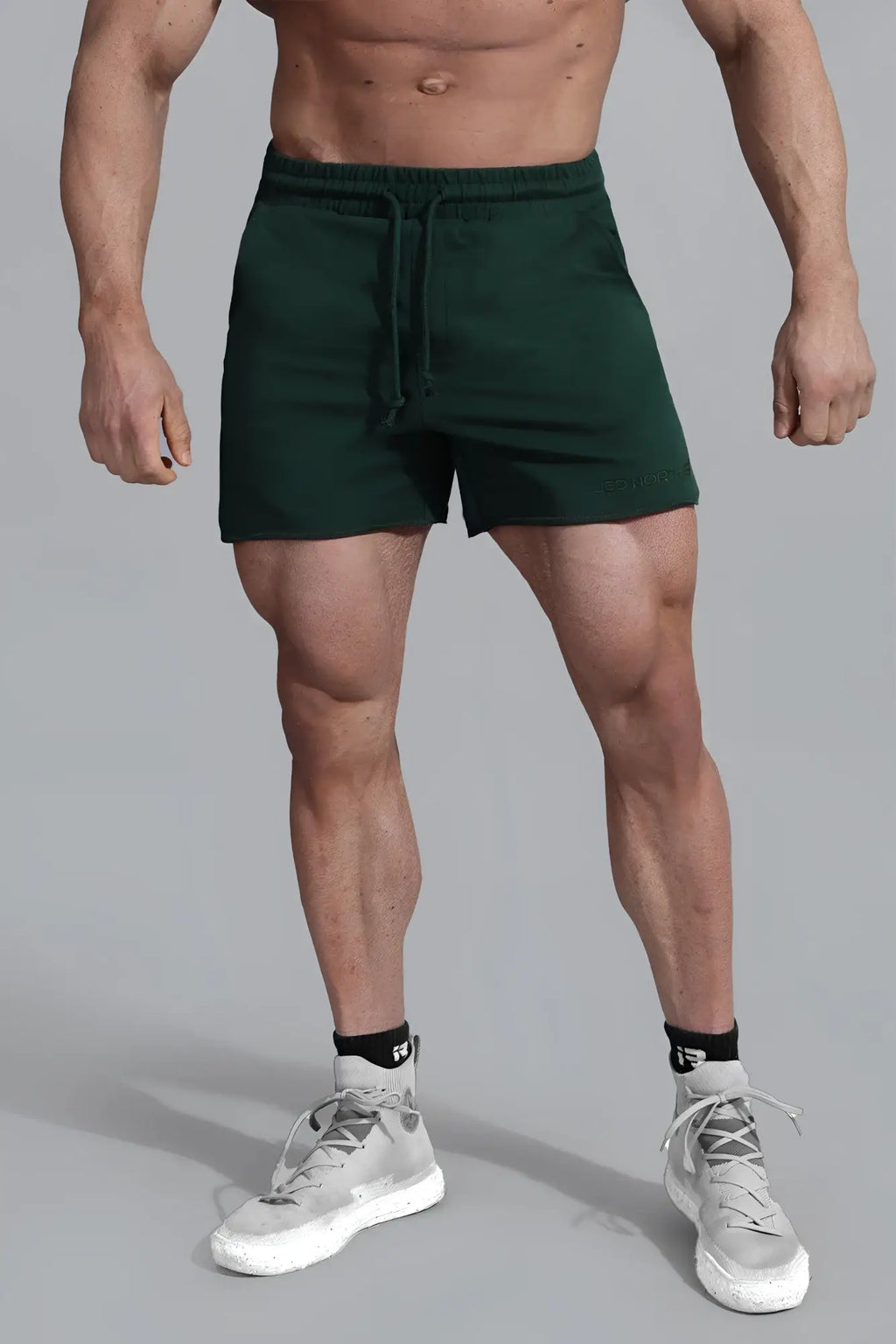 Jed North Motion 5 inch varsity sweat shorts in dark green with drawstring waistband and subtle lower right branding