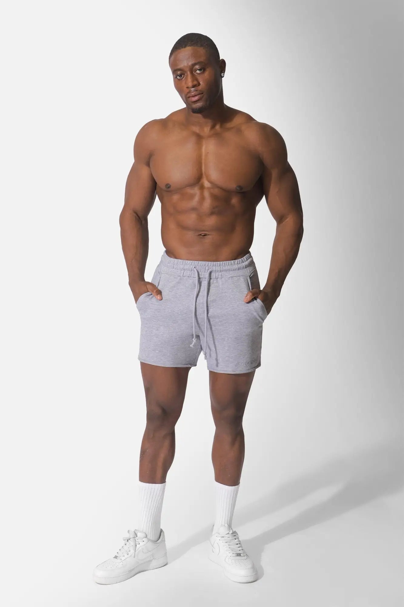 Gray jed north motion 5 inch varsity sweat shorts with drawstring waistband and side pockets for athletic use