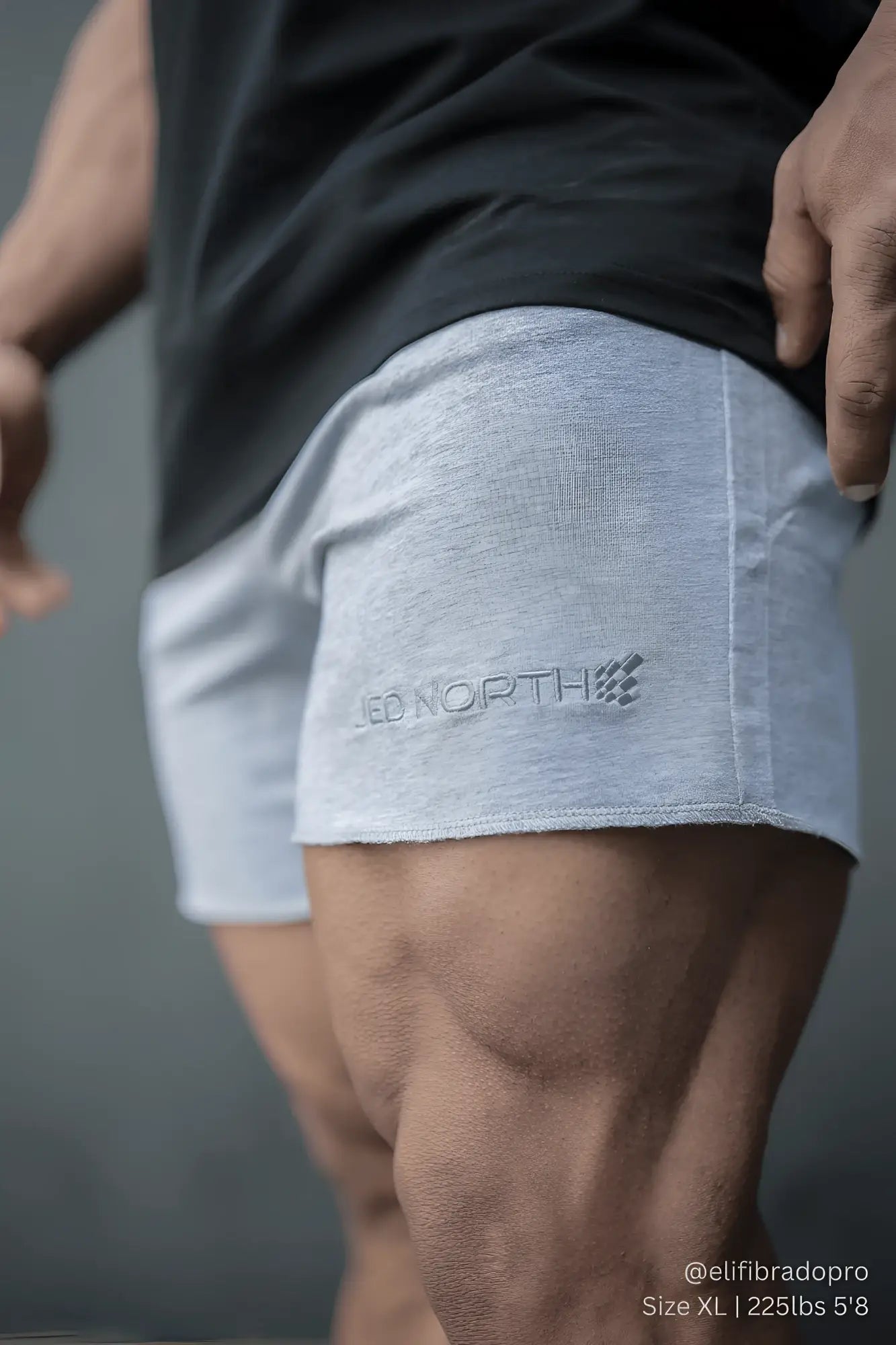 Light gray heathered Jed North motion 5 inch varsity sweat shorts with subtle logo embroidered on lower left leg