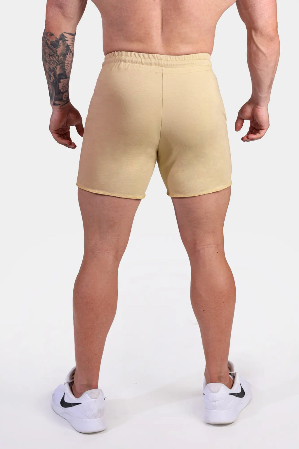 Beige Jed North Motion 5 inch varsity sweat shorts with elastic waistband and minimalist design in khaki color