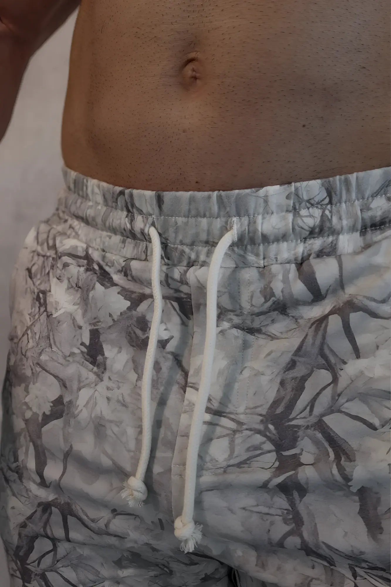 Motion 5 inch varsity sweat shorts in leaf camo with gray and white pattern and drawstring waistband for active wear