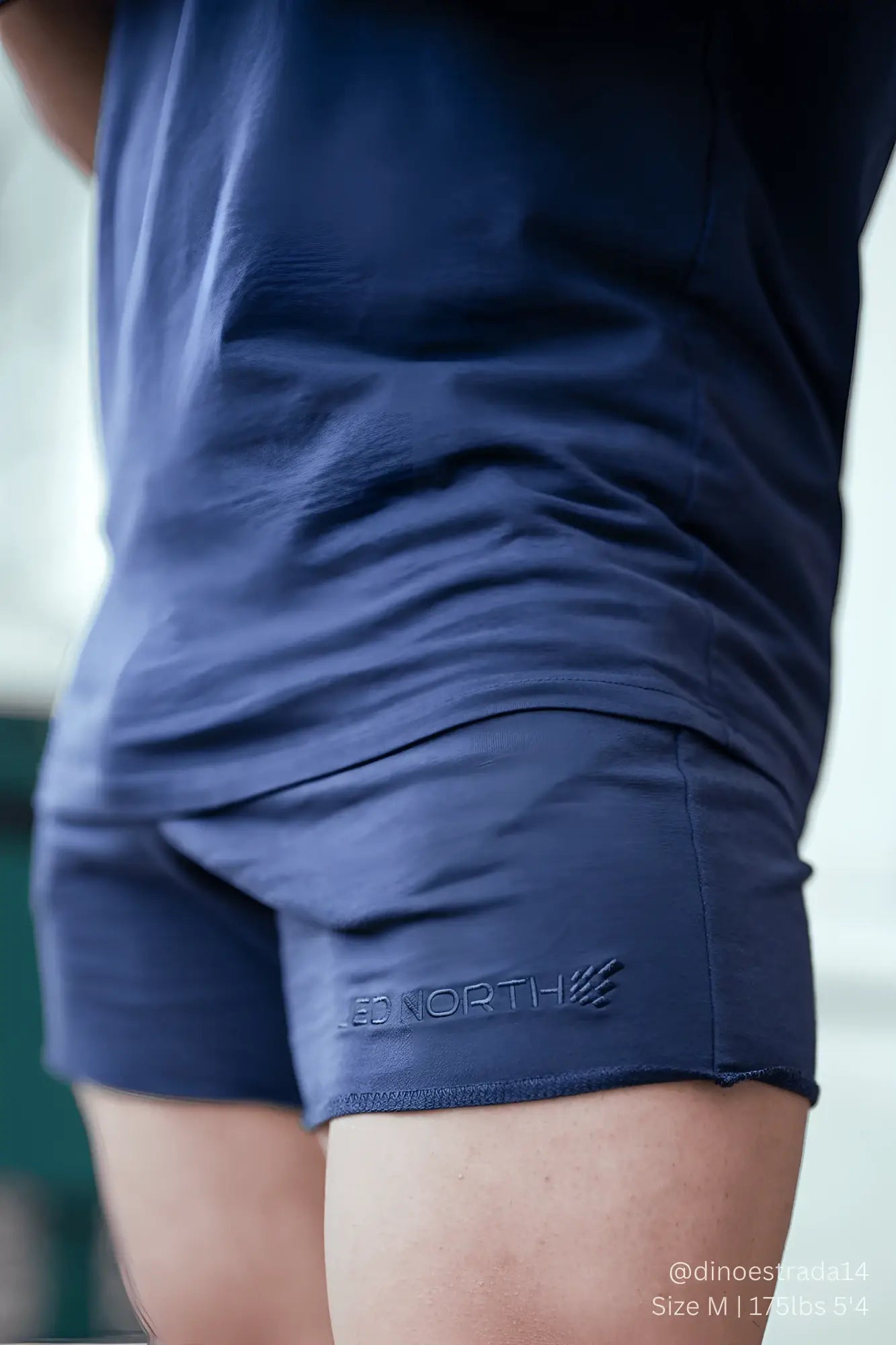 Navy jed north motion 5 inch varsity sweat shorts with red north embroidery on the lower leg seam