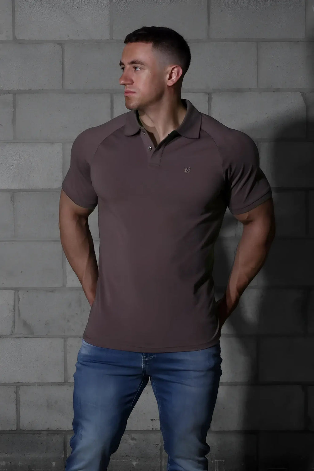 A sleek dark brown jed north muscle fit short-sleeved polo shirt with a subtle chest logo perfect for all-day wear