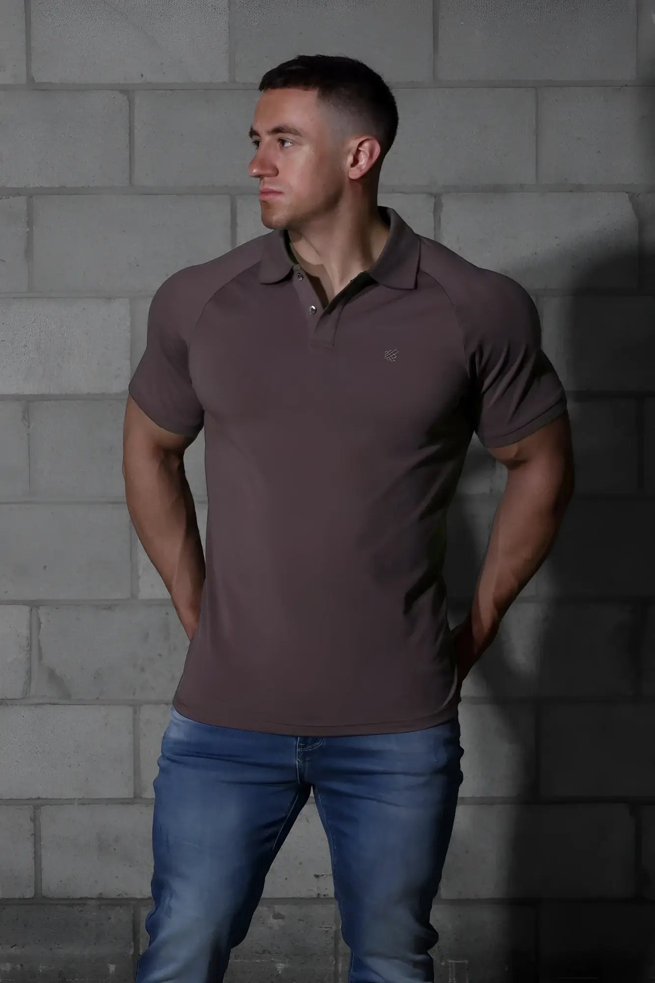 A sleek dark brown jed north muscle fit short-sleeved polo shirt with a subtle chest logo perfect for all-day wear