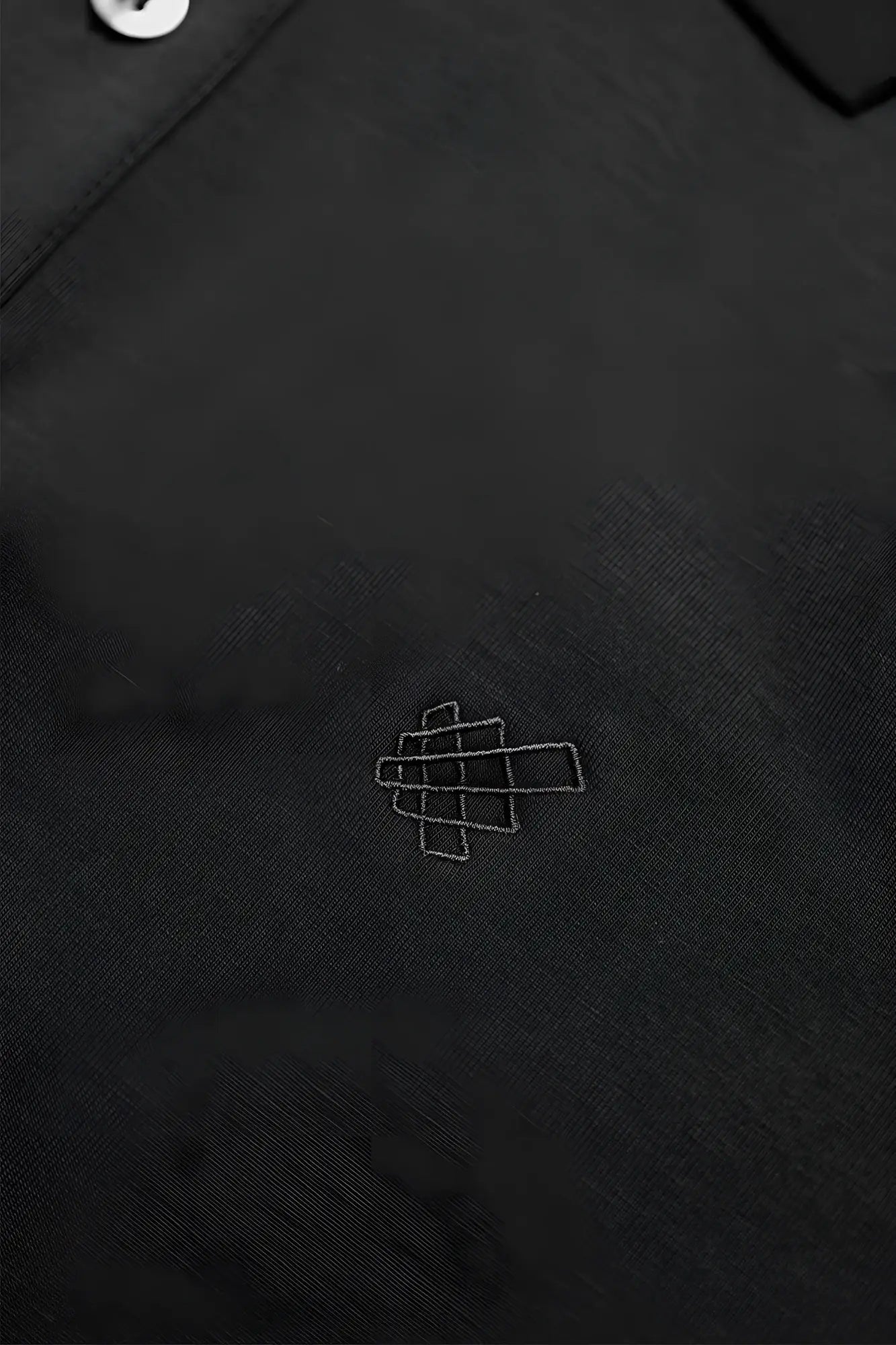 Jed North muscle fit all-day polo tshirt in onyx black with subtle white geometric logo embroidered on chest