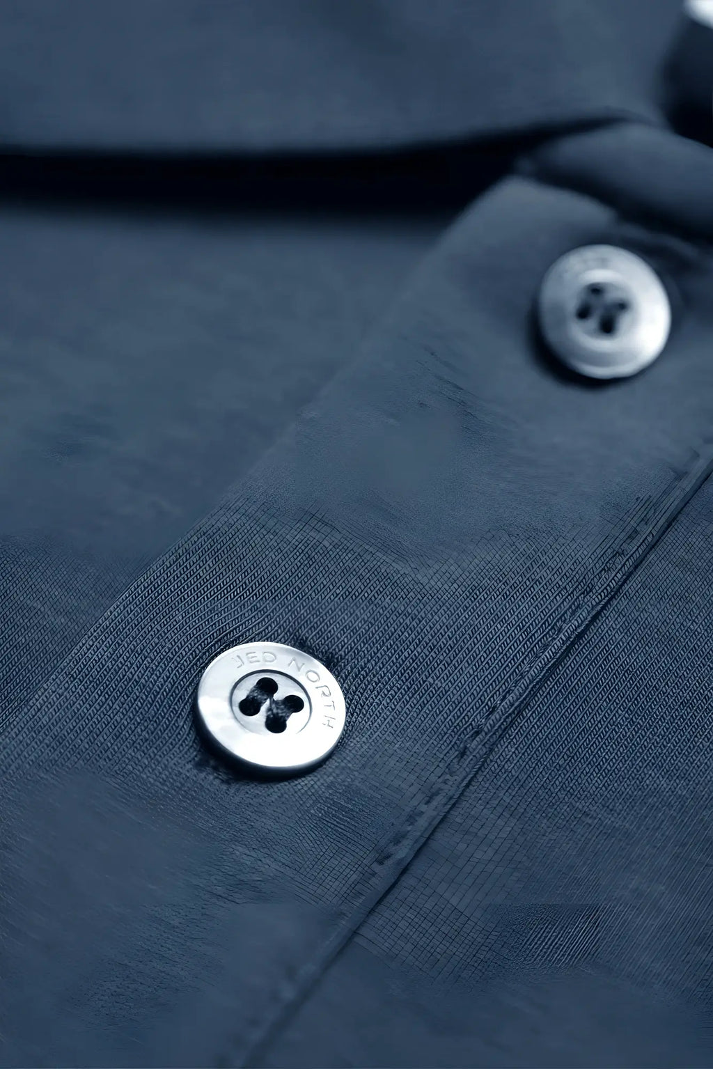 Muscle fit all-day polo t-shirt storm blue with silver four-hole buttons engraved jed roy on dark navy fabric