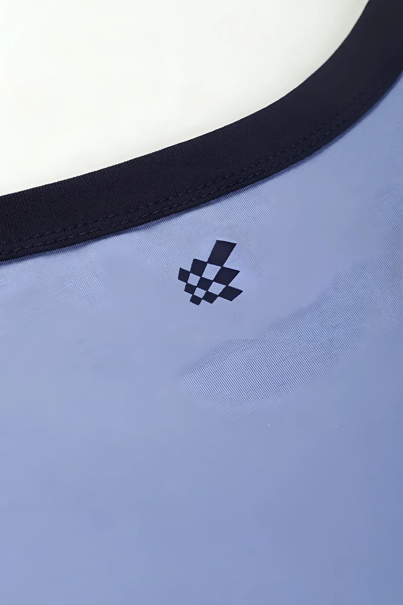 Muscle-fit ringer t-shirt in electric blue with light blue fabric black trim and small checkered logo on the chest