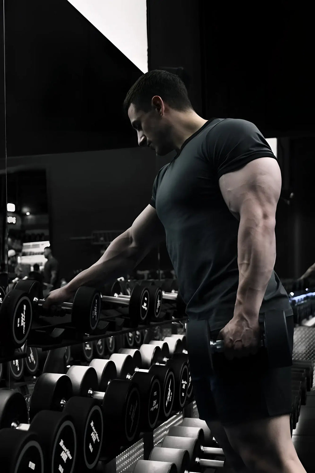 Muscle-fit ringer t-shirt in stone gray shown with a black matte dumbbell with silver weight plates