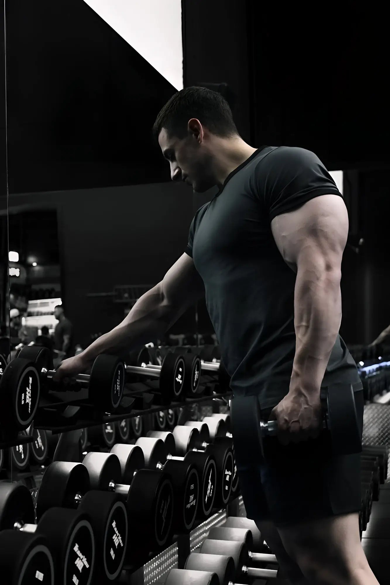 Muscle-fit ringer t-shirt in stone gray shown with a black matte dumbbell with silver weight plates