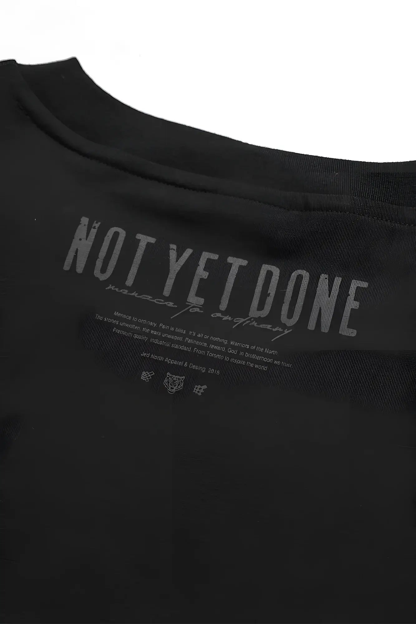 Oversized raw-cut cropped black cotton t-shirt with gray not yet done graphic printed inside the collar