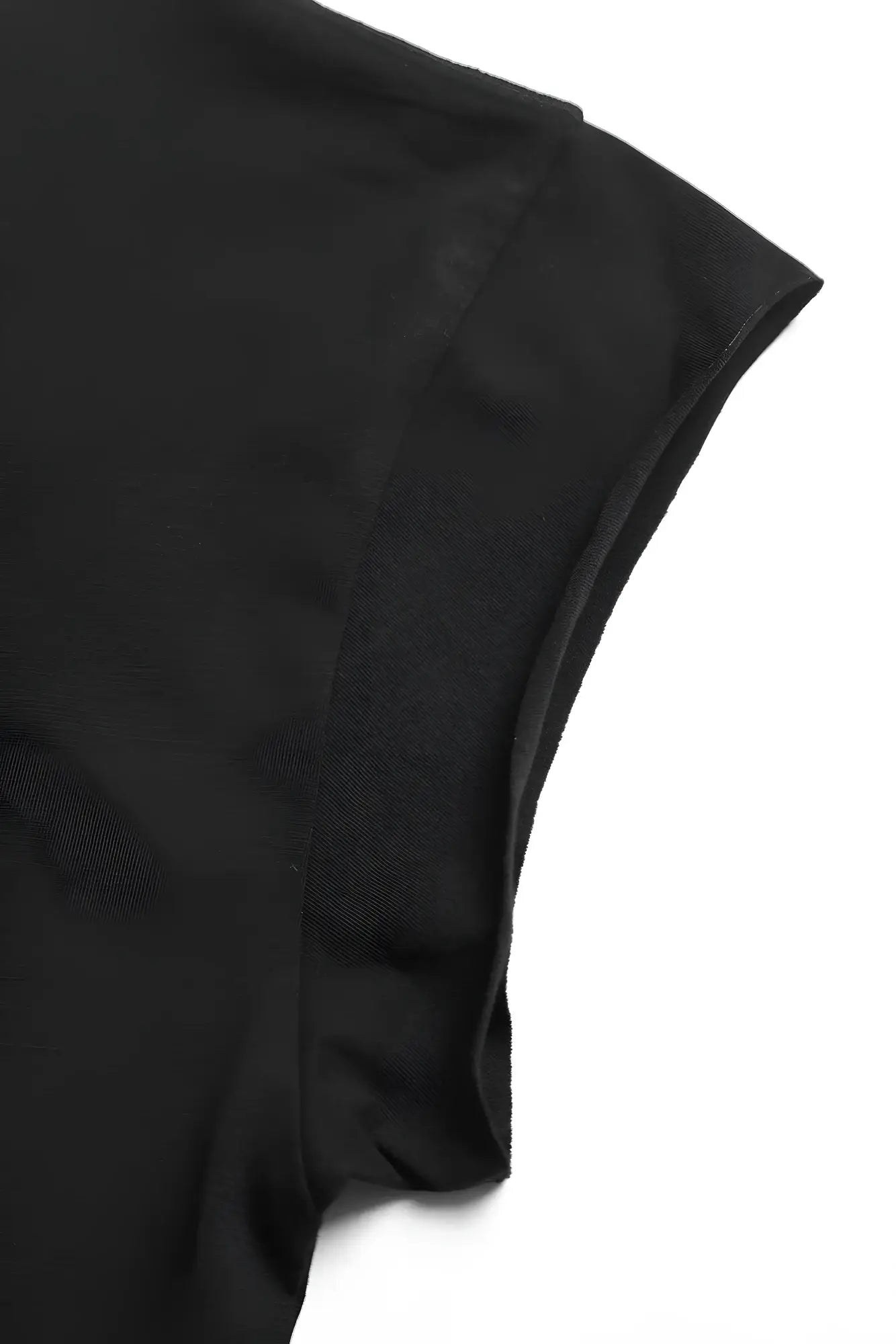 Black oversized raw cut cropped tee sleeve made from smooth slightly glossy fabric