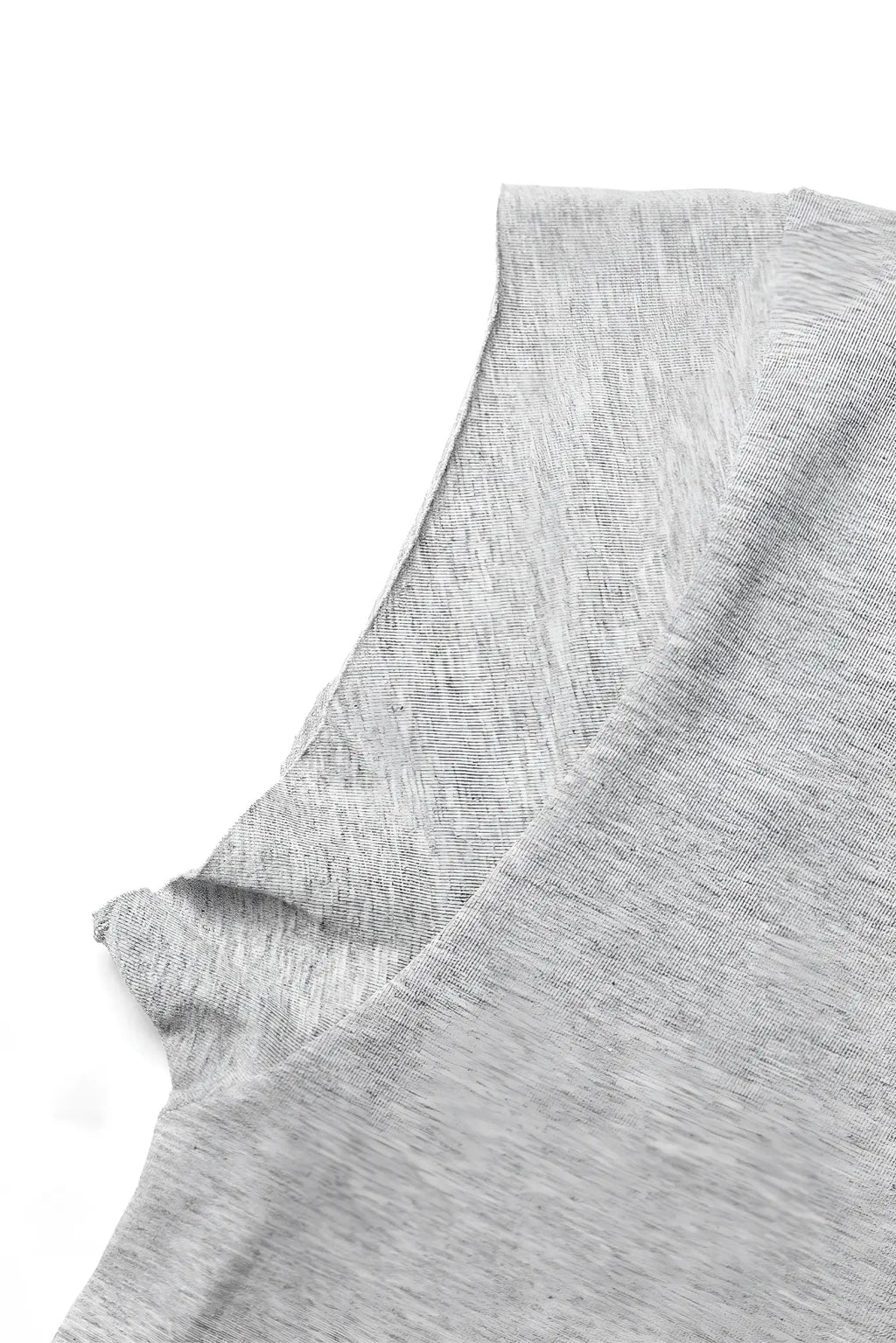 Gray heathered oversized raw-cut cropped tee in soft cotton with a rounded neckline and textured fabric