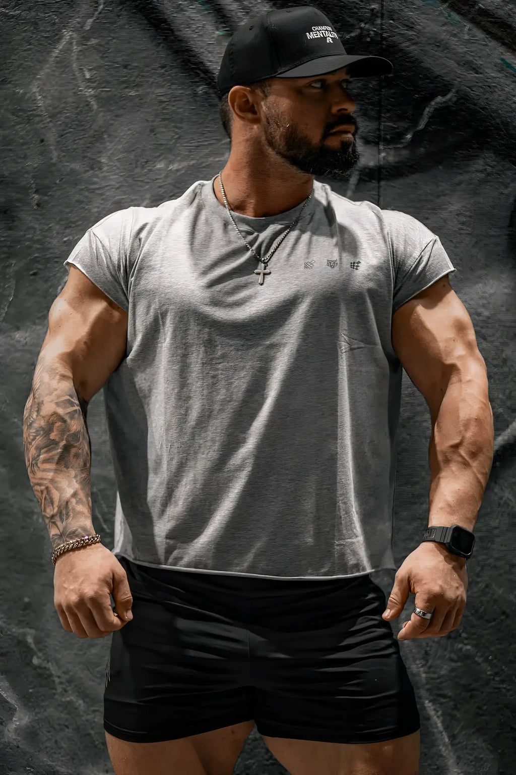 Oversized raw-cut cropped tee in heather gray with short sleeves a front pocket and small chest logo