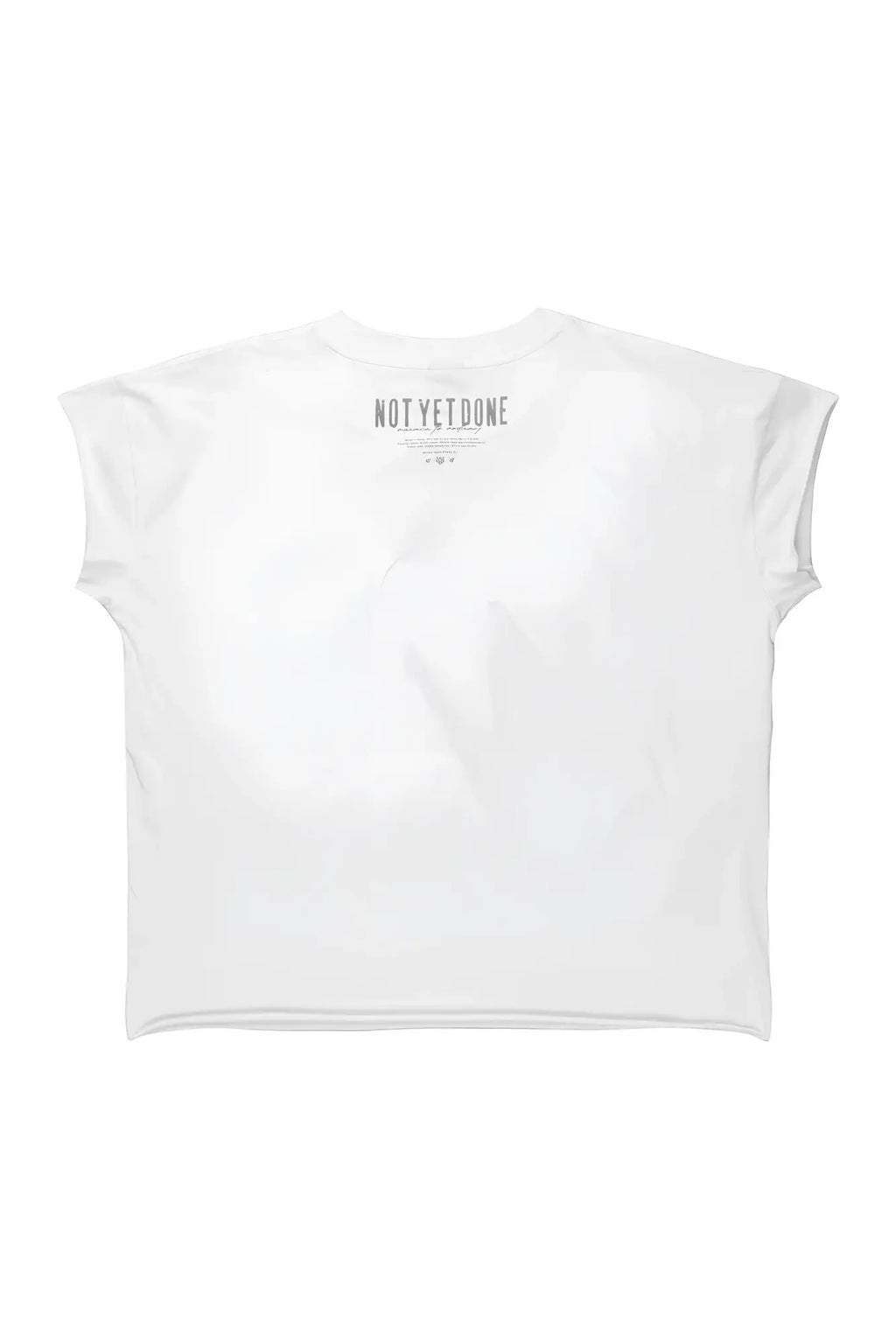 White oversized raw-cut cropped t-shirt with short sleeves and minimalist gray not yet done graphic at neckline