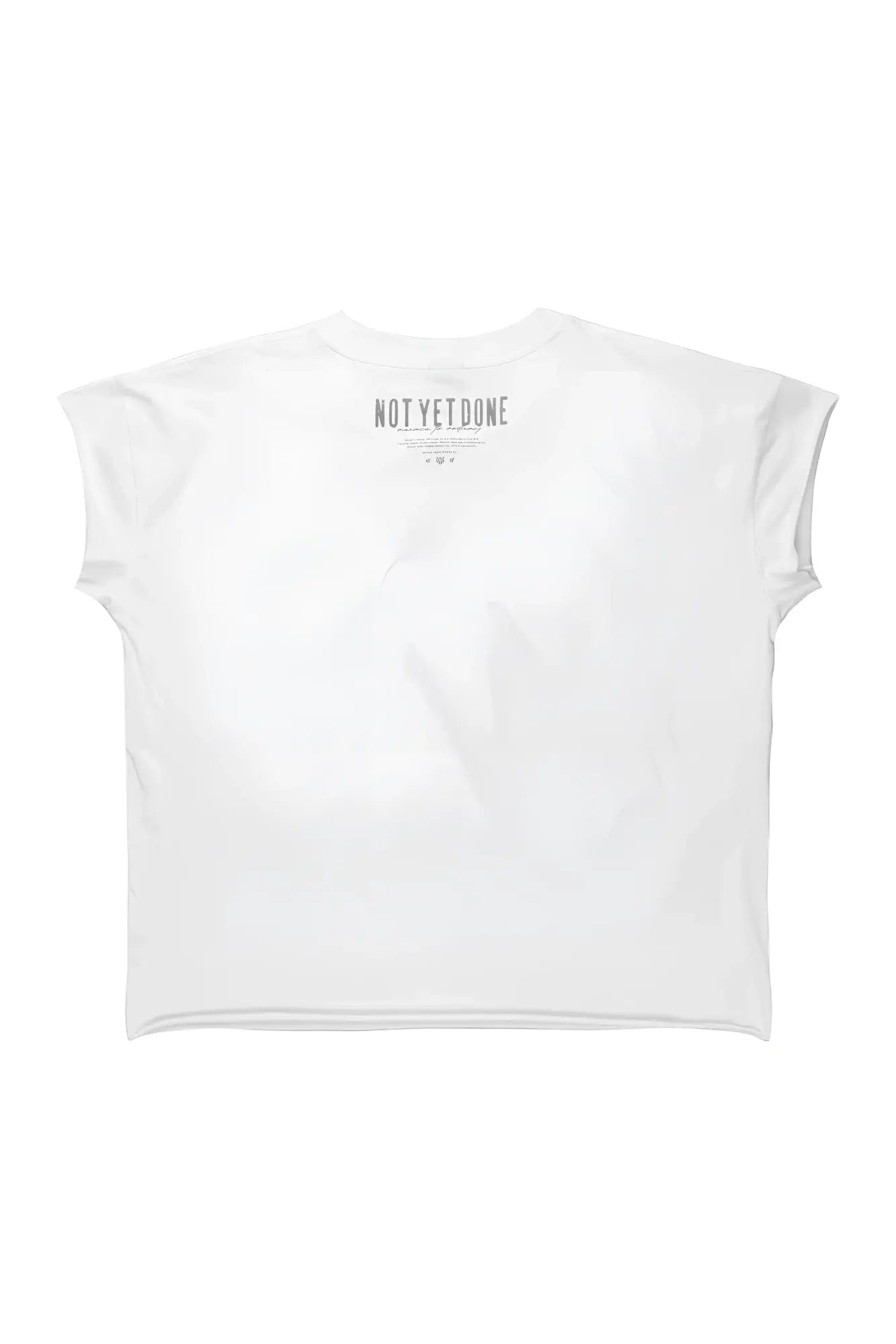 White oversized raw-cut cropped t-shirt with short sleeves and minimalist gray not yet done graphic at neckline