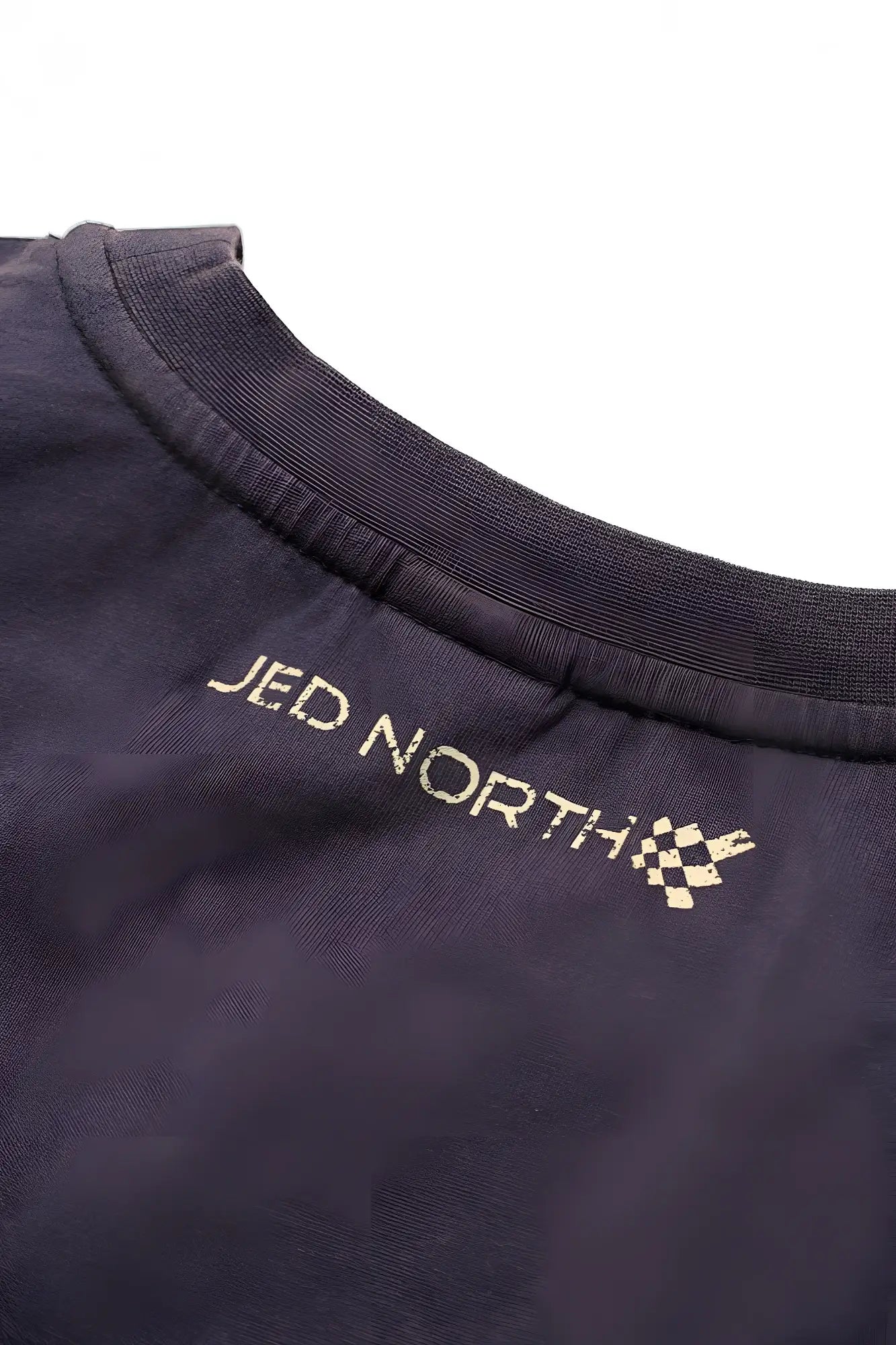 Dark navy oversized washed sleeveless cotton t-shirt with jed north embroidered in gold and checkered flag logo