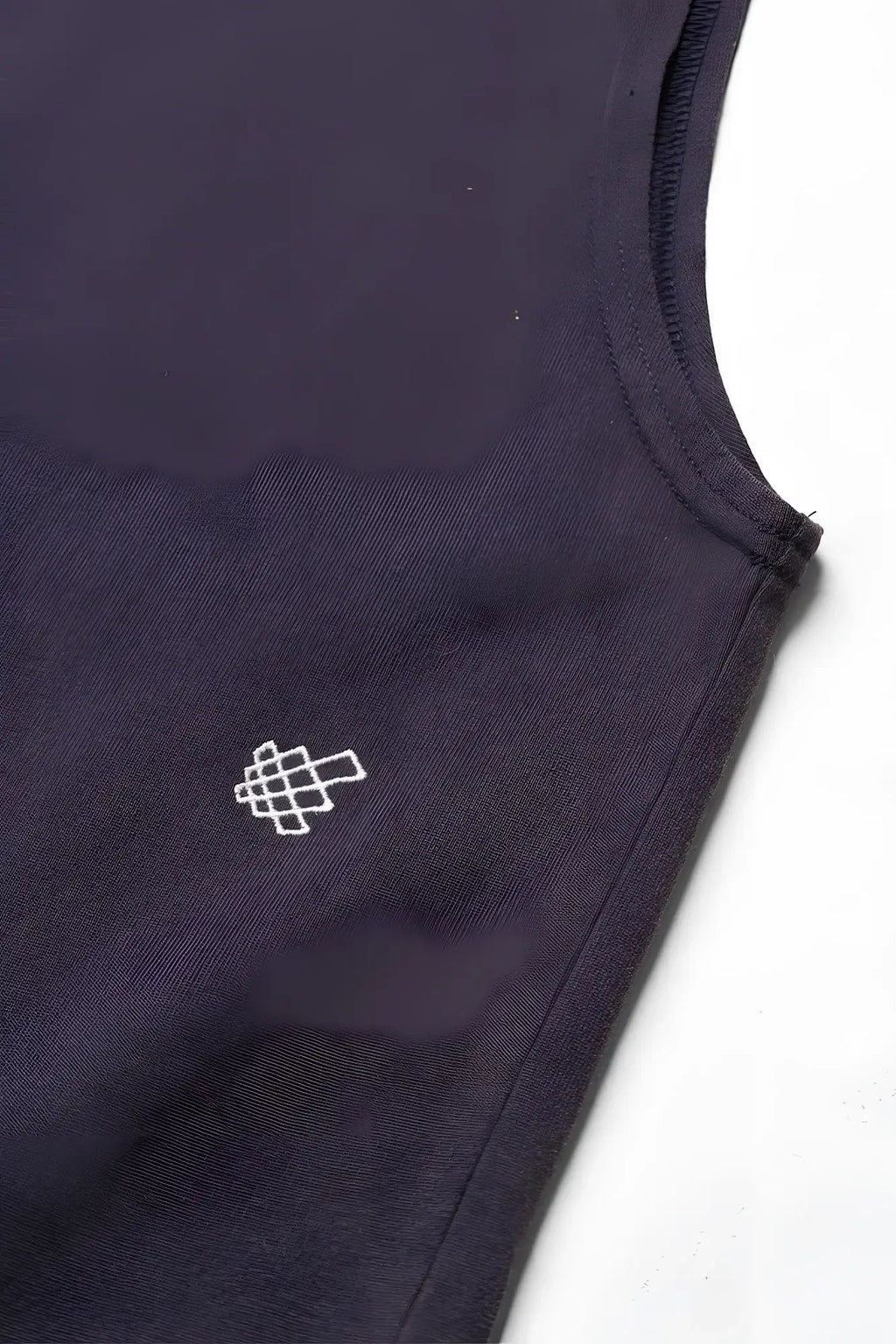 Jed North oversized washed sleeveless t-shirt in washed navy with small white geometric embroidery on chest