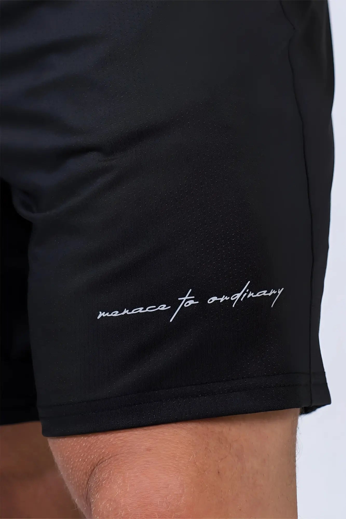 Jed North performance air-tech black athletic shorts with subtle textured fabric and menace to ordinary embroidery