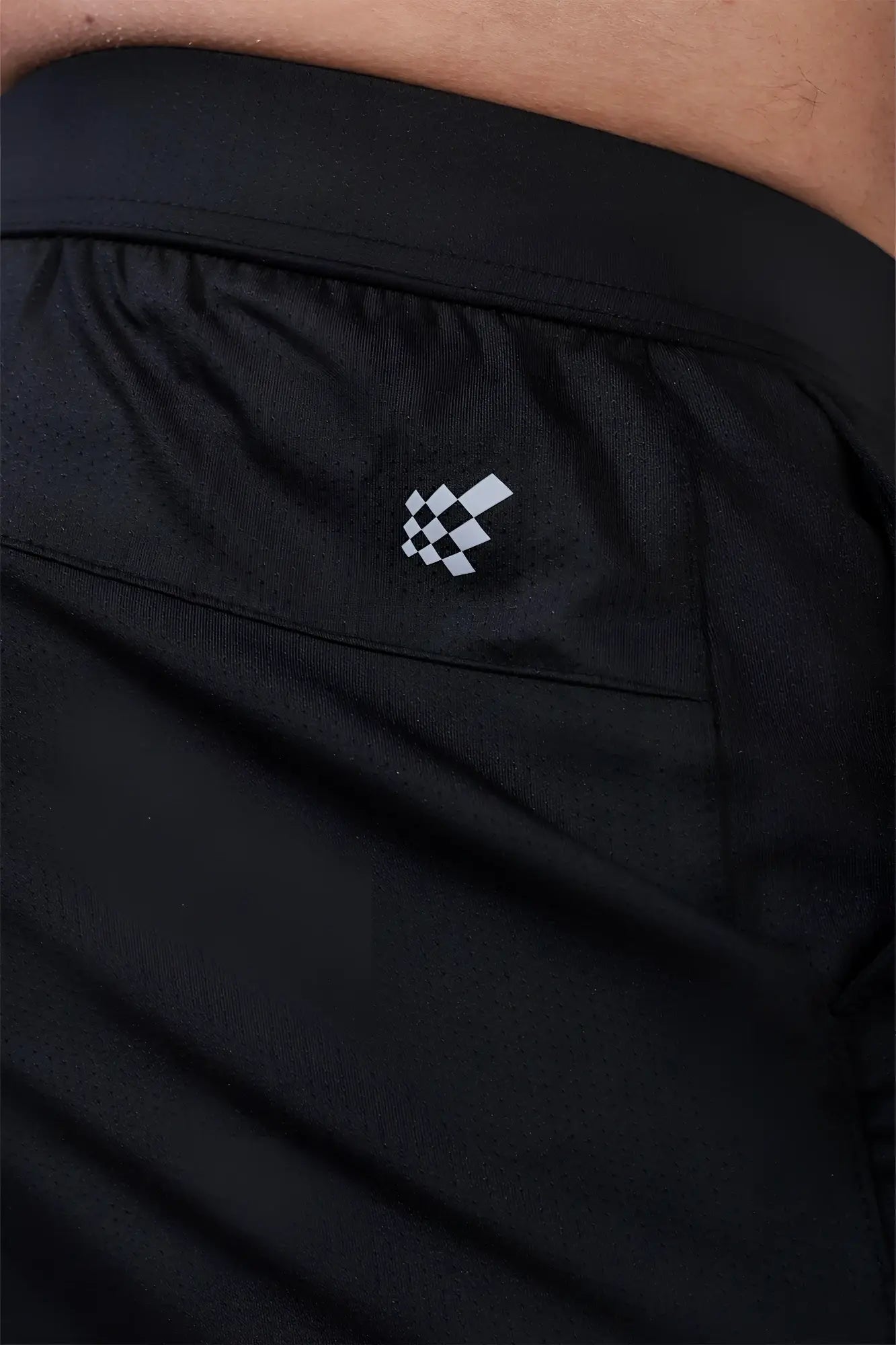 Jed north performance air-tech black athletic shorts with subtle white checkered logo on waistband