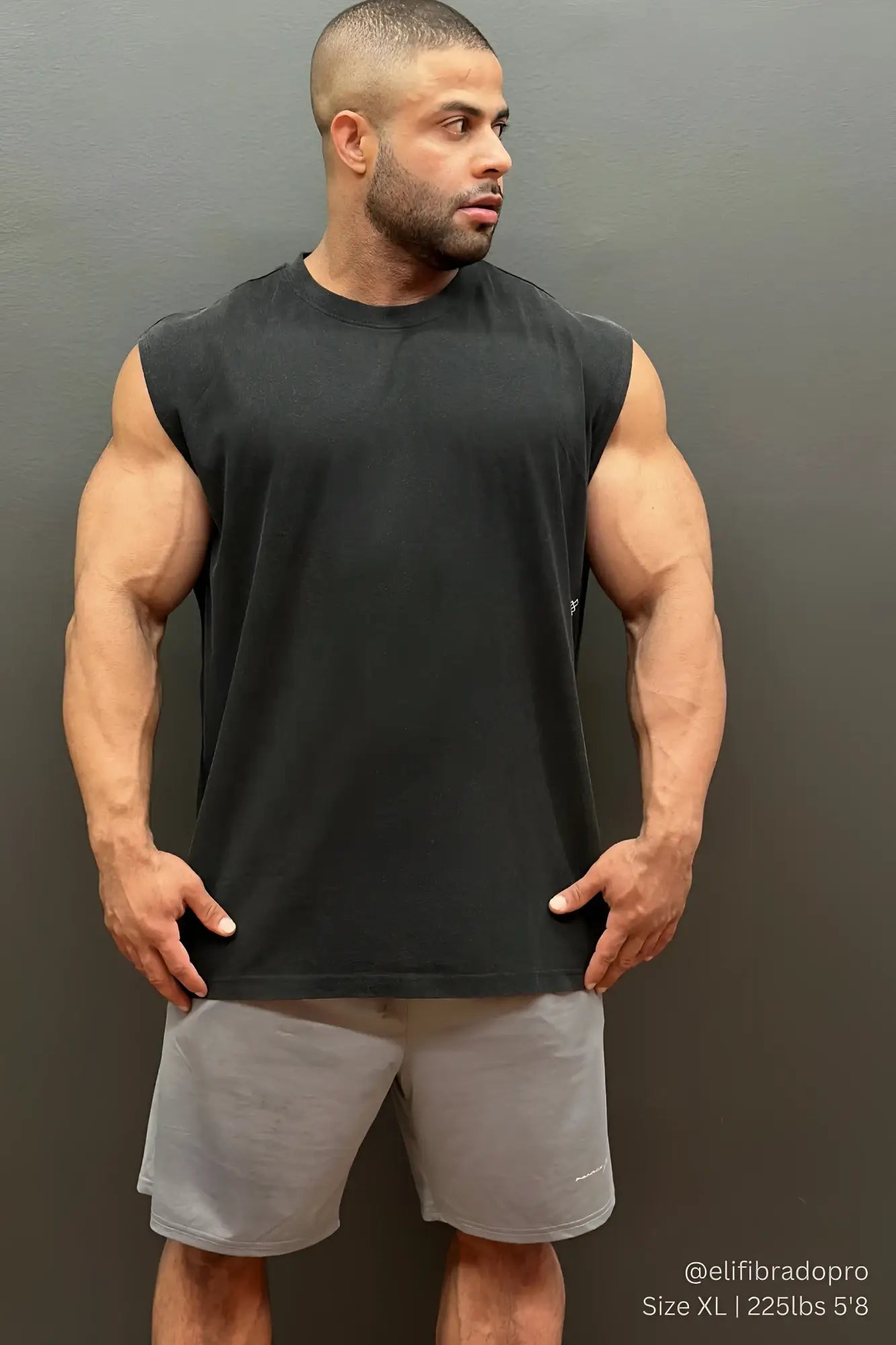 Black sleeveless muscle tank top paired with jed north performance air-tech gray athletic shorts for workout use