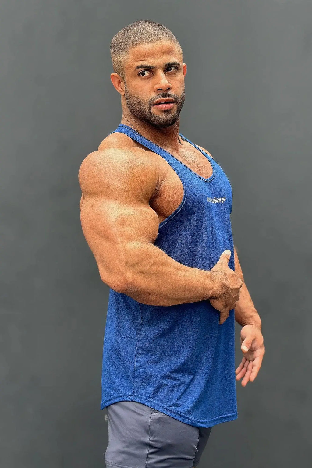 Blue jed north performance max bodybuilding stringer tank top with subtle textured fabric and small white logo on chest