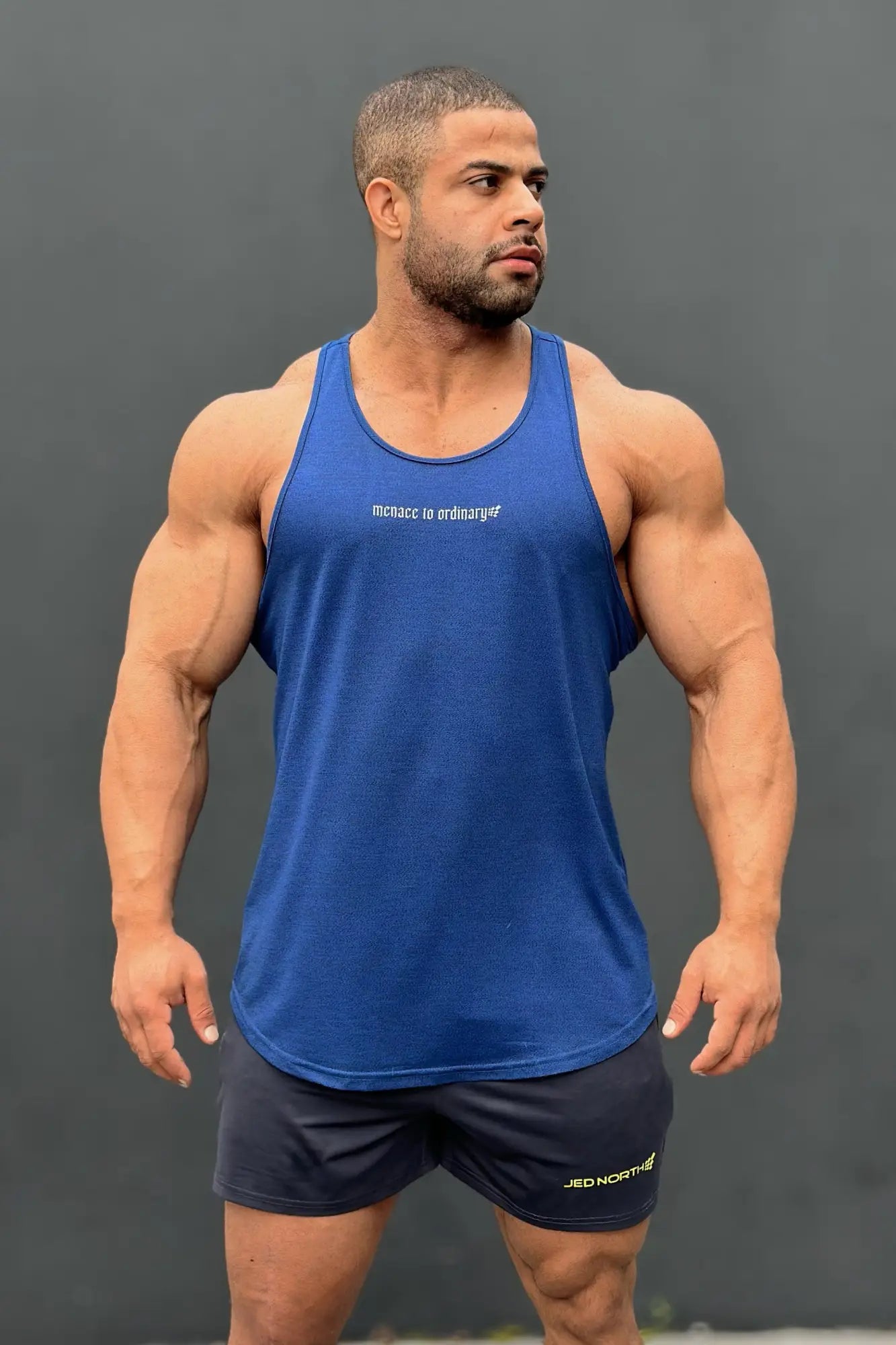 Blue jed north performance max bodybuilding stringer tank top with white text for athletic training and workouts