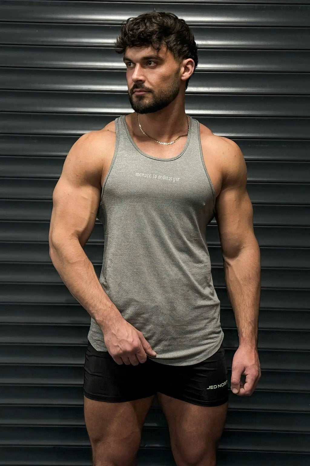 Gray jed north performance max bodybuilding stringer tank top with textured weave and white embroidered chest text