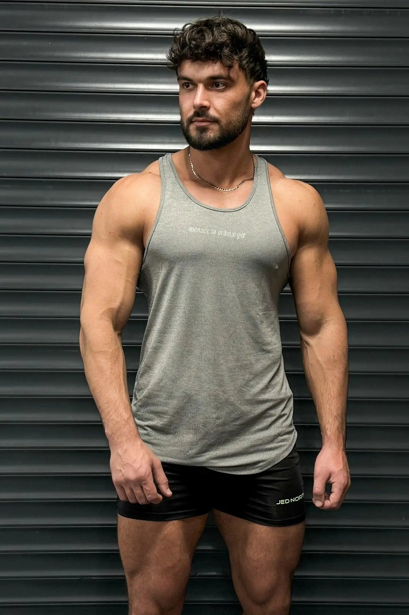 Jed North performance max bodybuilding stringer in heather gray with subtle textured fabric and small white chest text