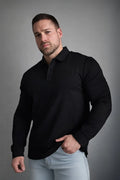 Black long-sleeved polo button-up shirt with classic collar and subtle ribbed placket for casual or formal wear