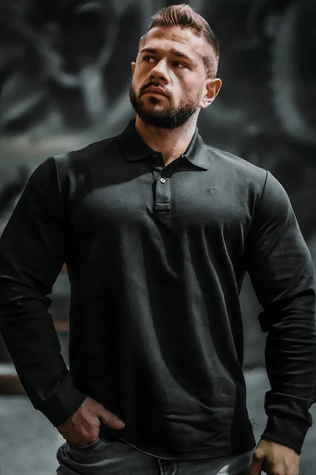 Black polo button-up longsleeve shirt with subtle textured fabric and small embroidered chest logo