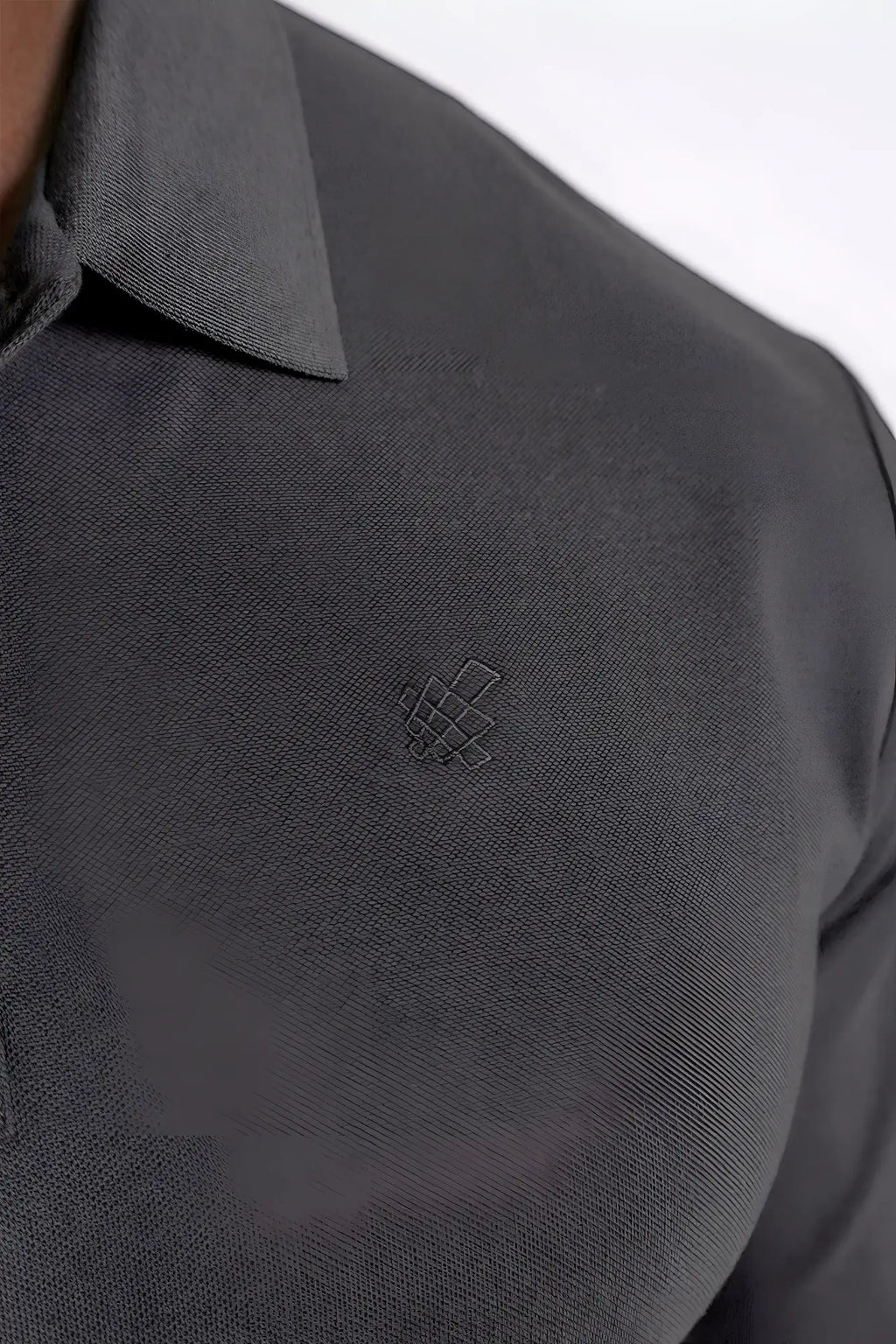 Dark gray polo button-up longsleeve with subtle textured weave and small embroidered logo on the chest