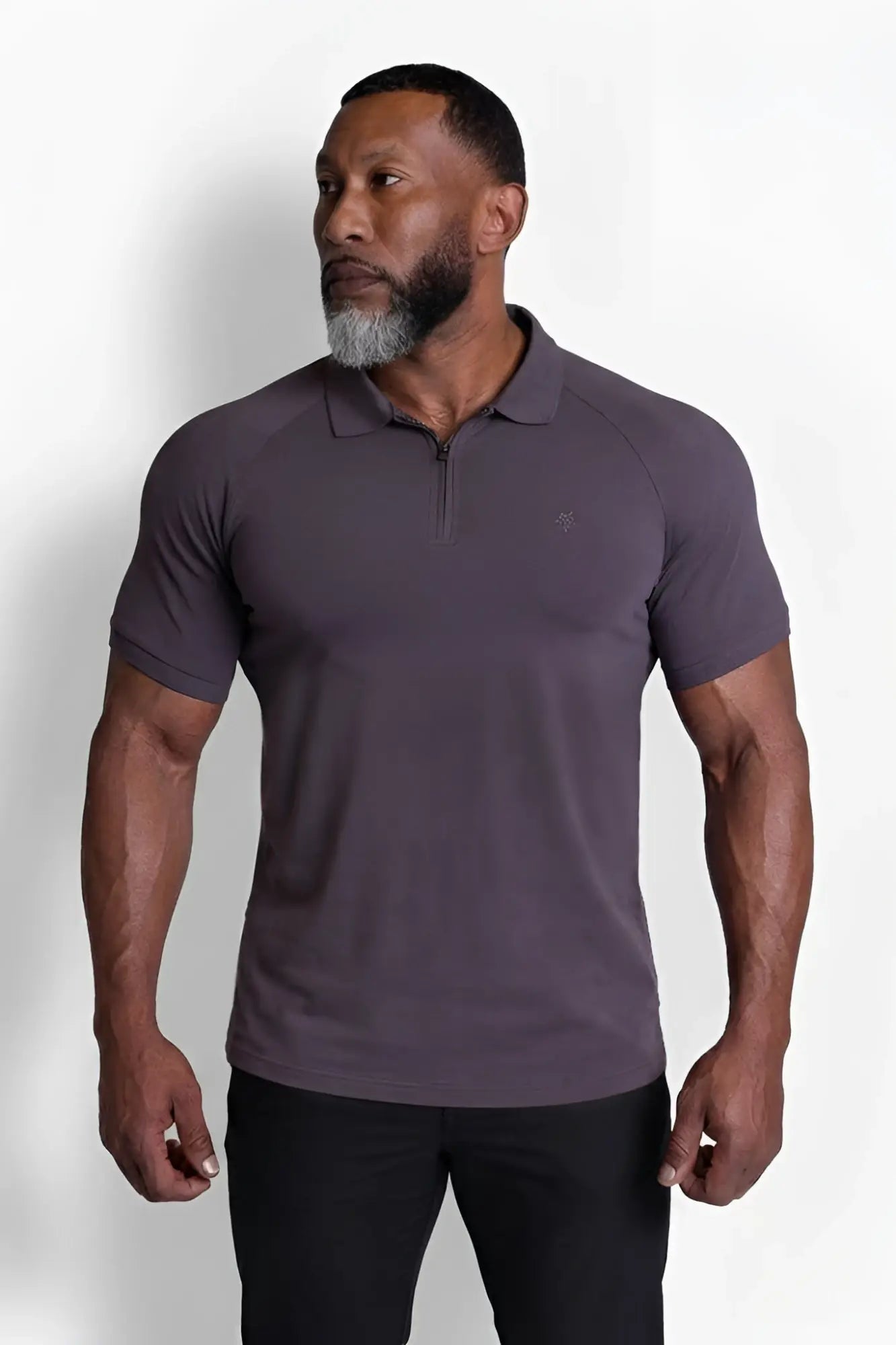 Premium muscle-fit dark gray polo tee with short sleeves subtle textured fabric and small embroidered chest logo