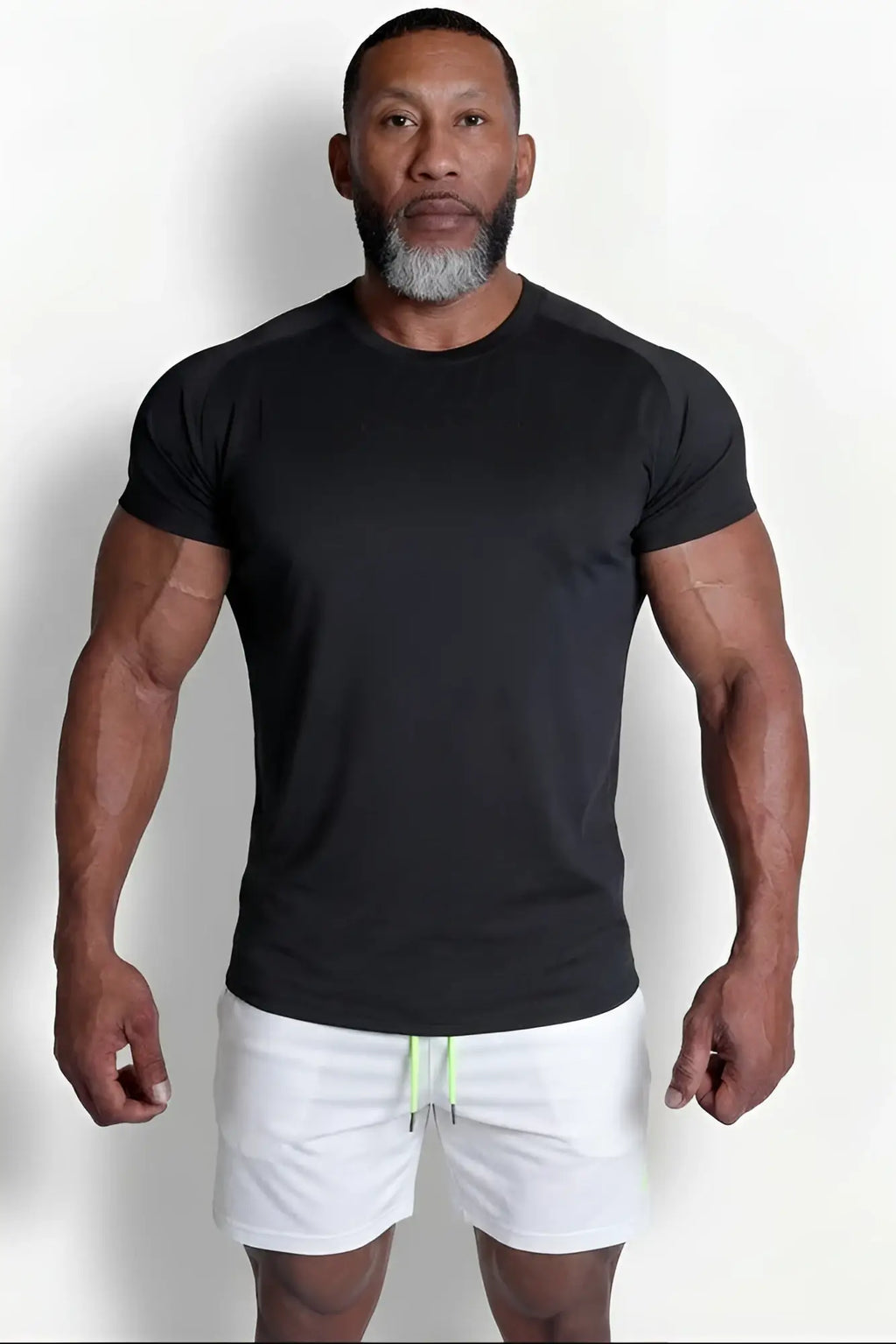 Premium training tee black short-sleeved athletic t-shirt with crew neck and subtle side panels for workouts