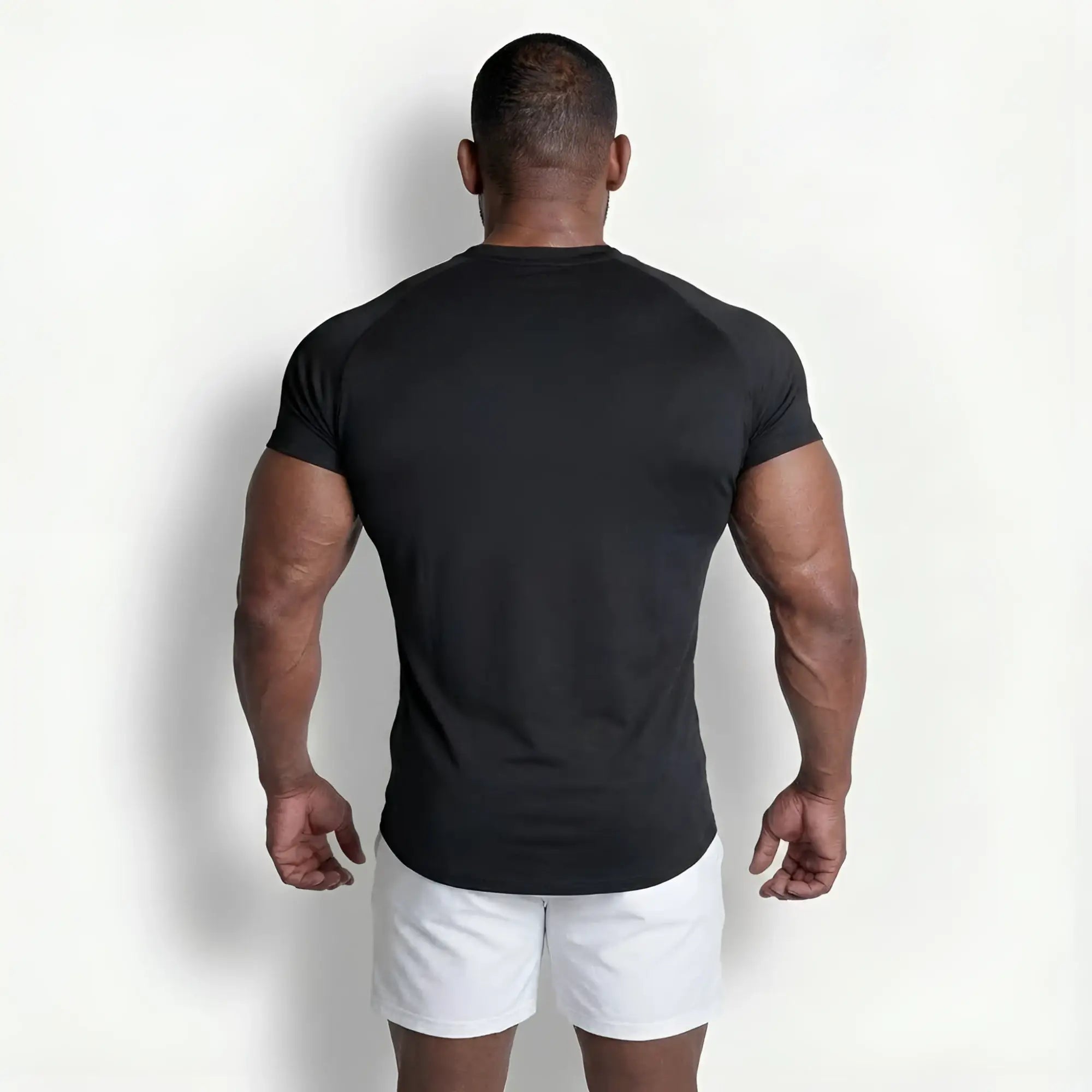 Black premium training tee with fitted cut and raglan short sleeves designed for athletic performance