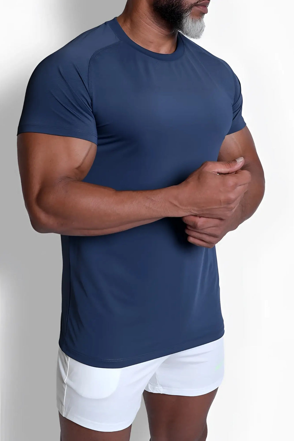 Navy blue short-sleeved athletic t-shirt with subtle textured pattern and raglan sleeves for premium training