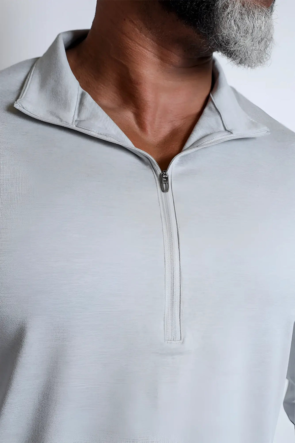 Light gray quarter-zip training long sleeve polo shirt with heathered texture and modern sleek design
