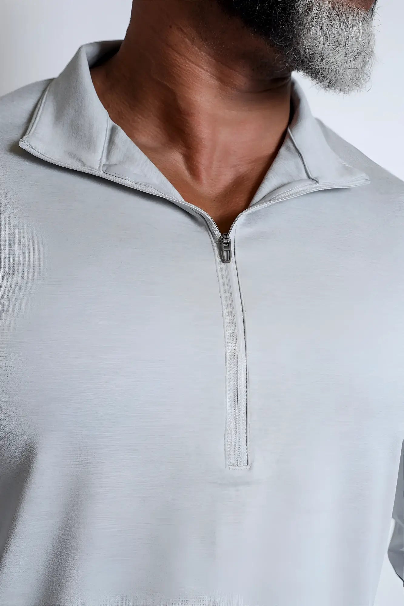 Light gray quarter-zip training long sleeve polo shirt with heathered texture and modern sleek design
