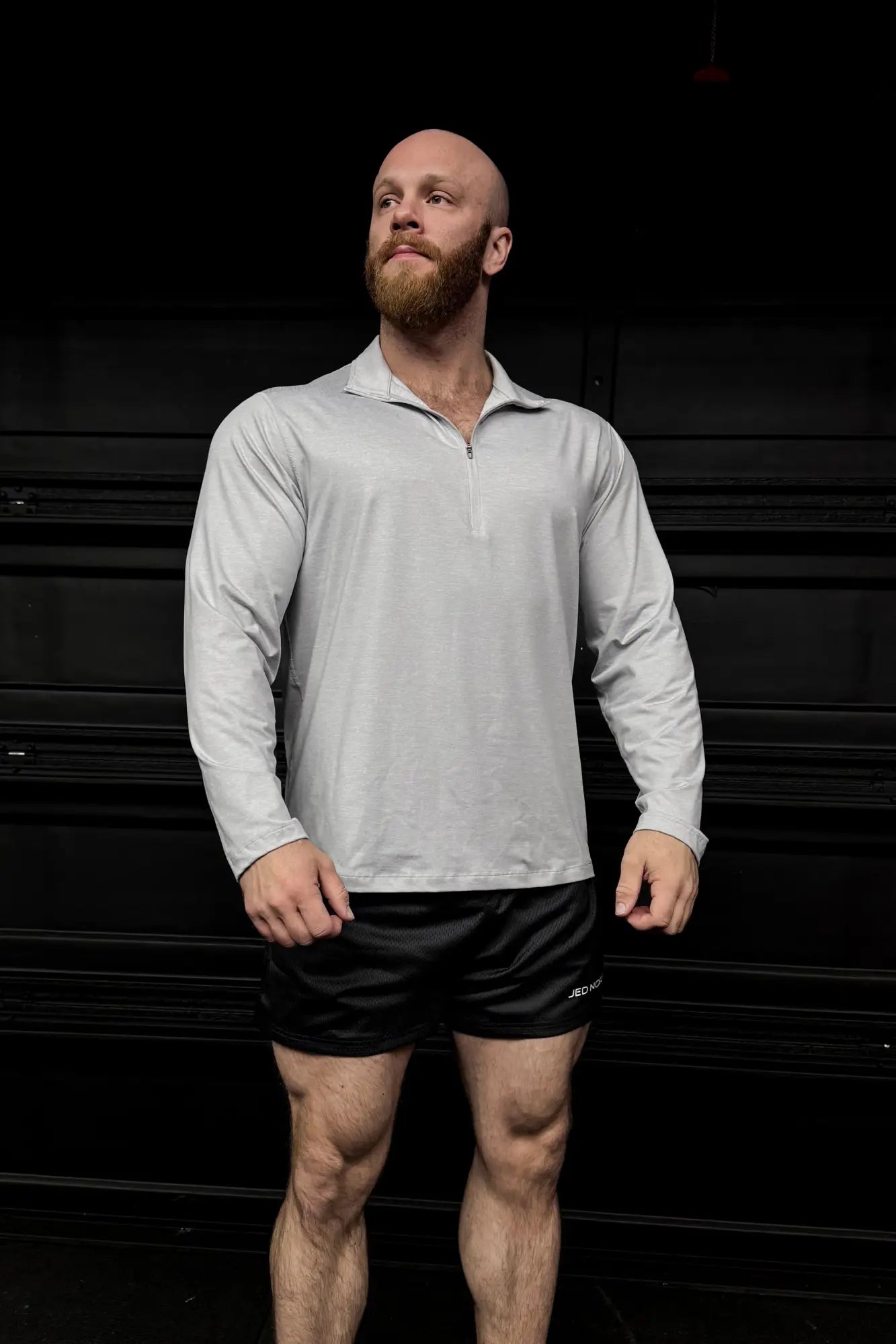 Light gray heather quarter-zip training long sleeve shirt with long sleeves and zipper for athletic use